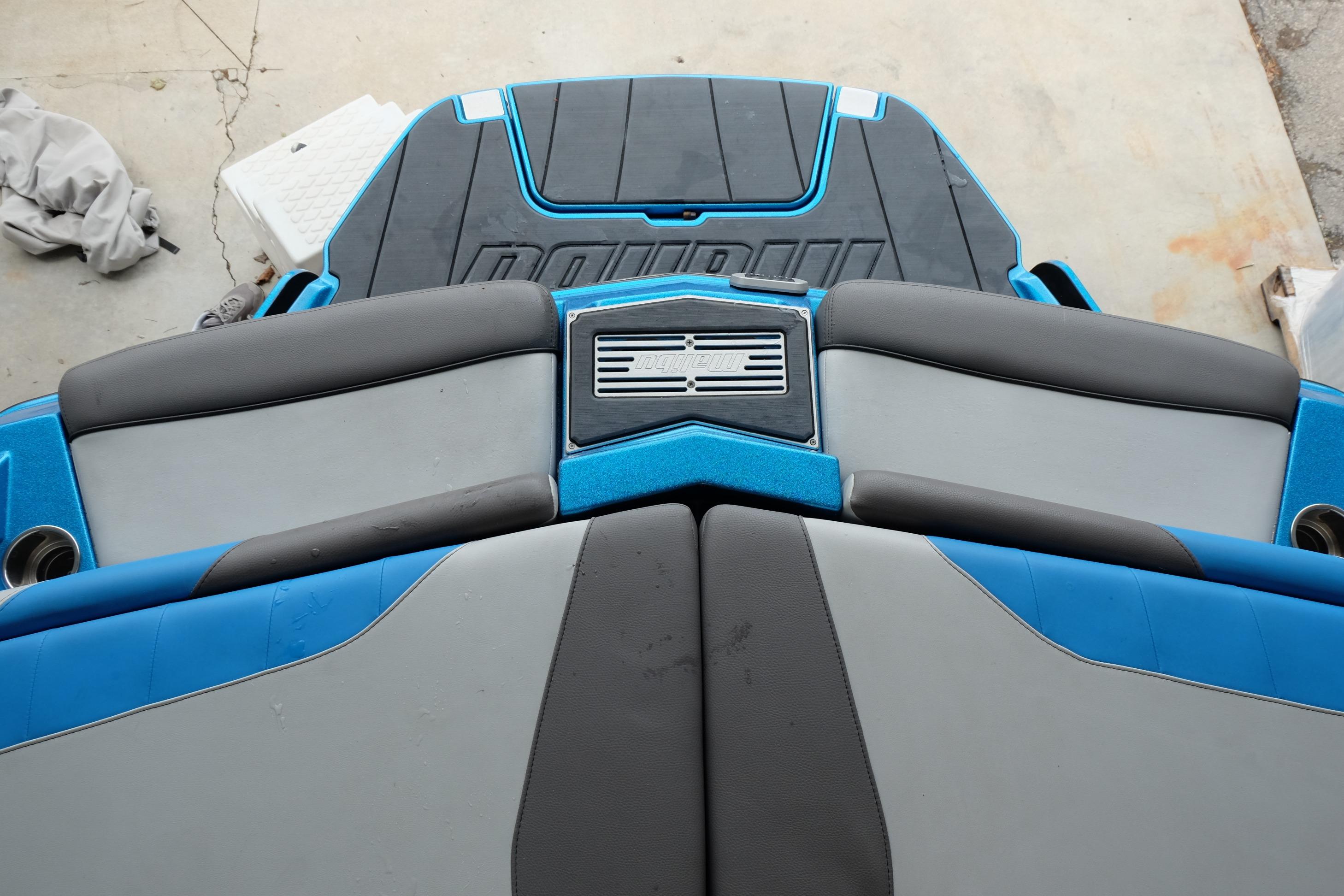 2020 Malibu Wakesetter 23 LSV boat interior with blue and gray seating.
