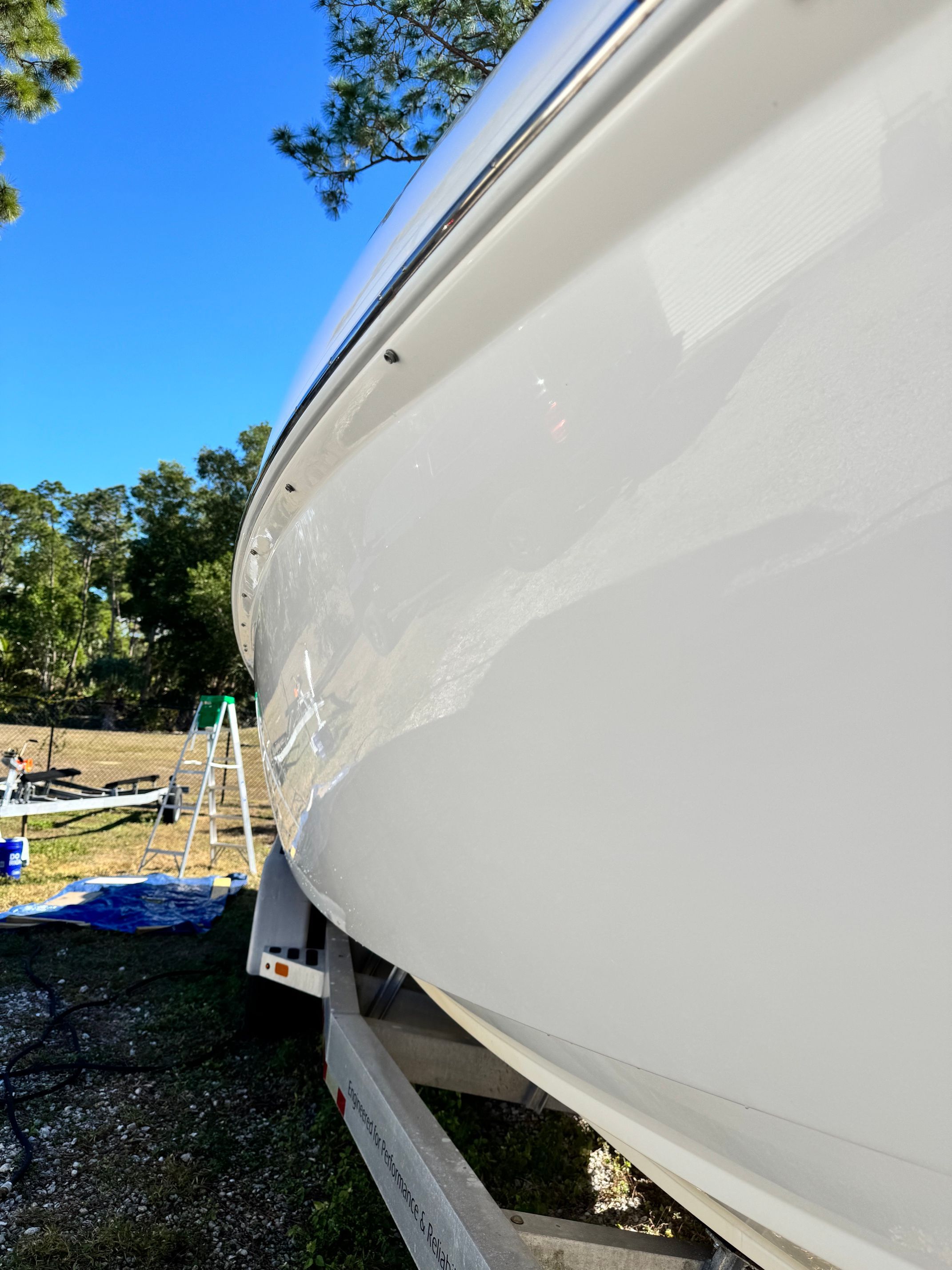 2017 Sunsation 32 CCX boat on trailer, side view.