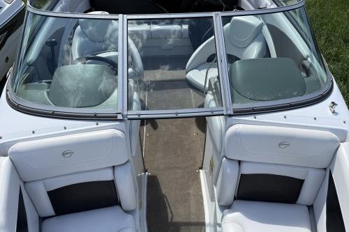 2012 Crownline 215 SS boat interior with white seating and glass windshield.
