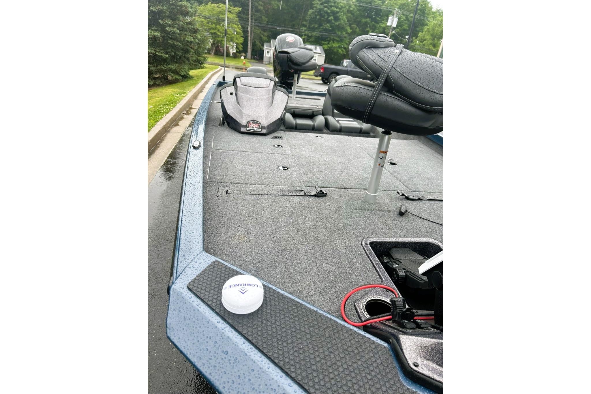 2026 Ranger RT188P fishing boat deck with seats and equipment, parked outdoors.
