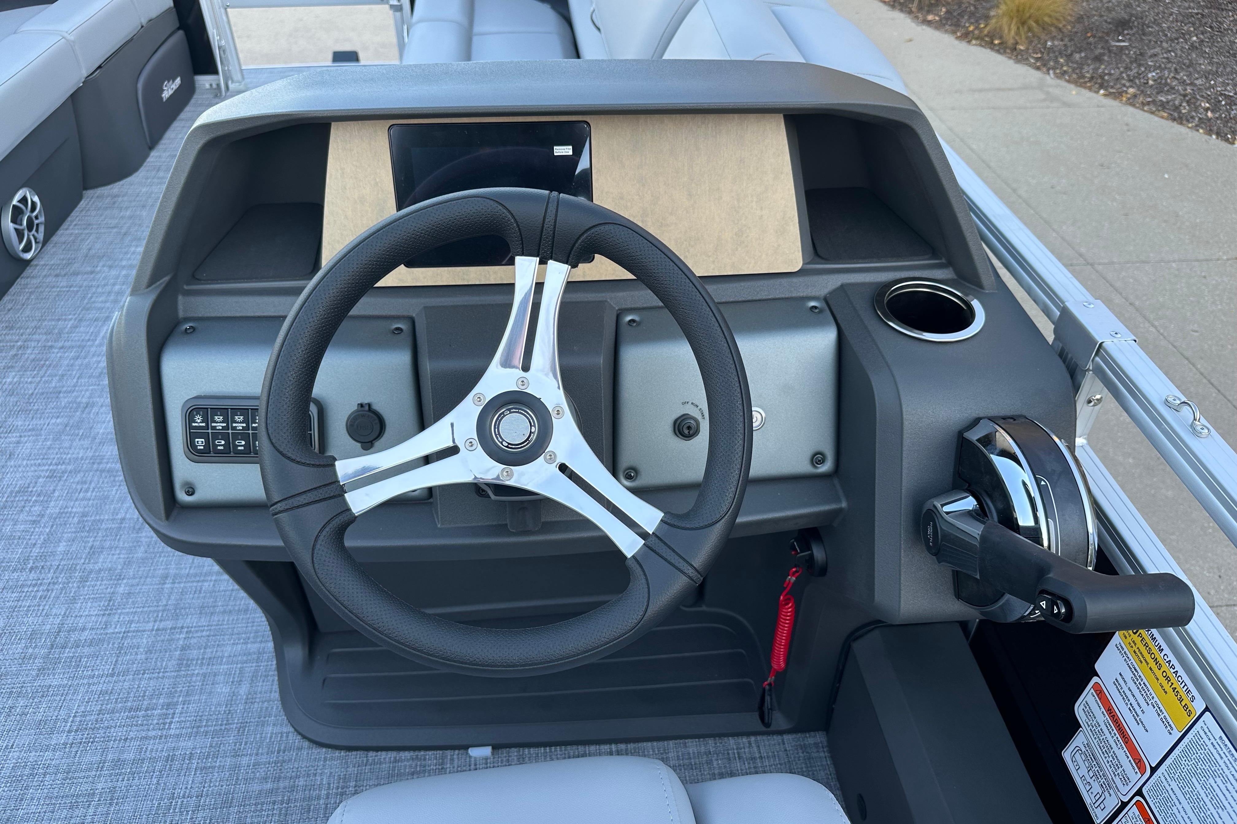 Steering console of 2026 Sun Tracker SportFish 22 DLX pontoon boat.