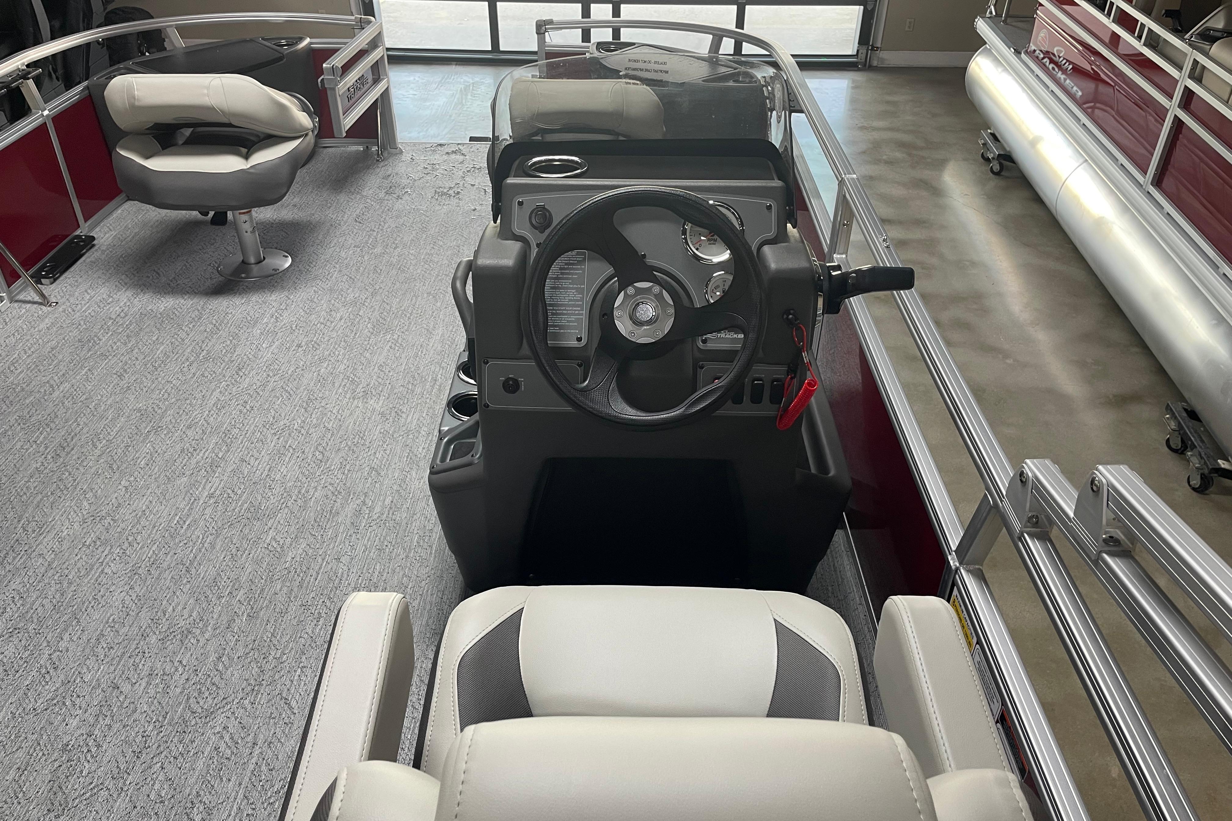 Interior view of 2026 Sun Tracker Bass Buggy 18 DLX pontoon boat cockpit.