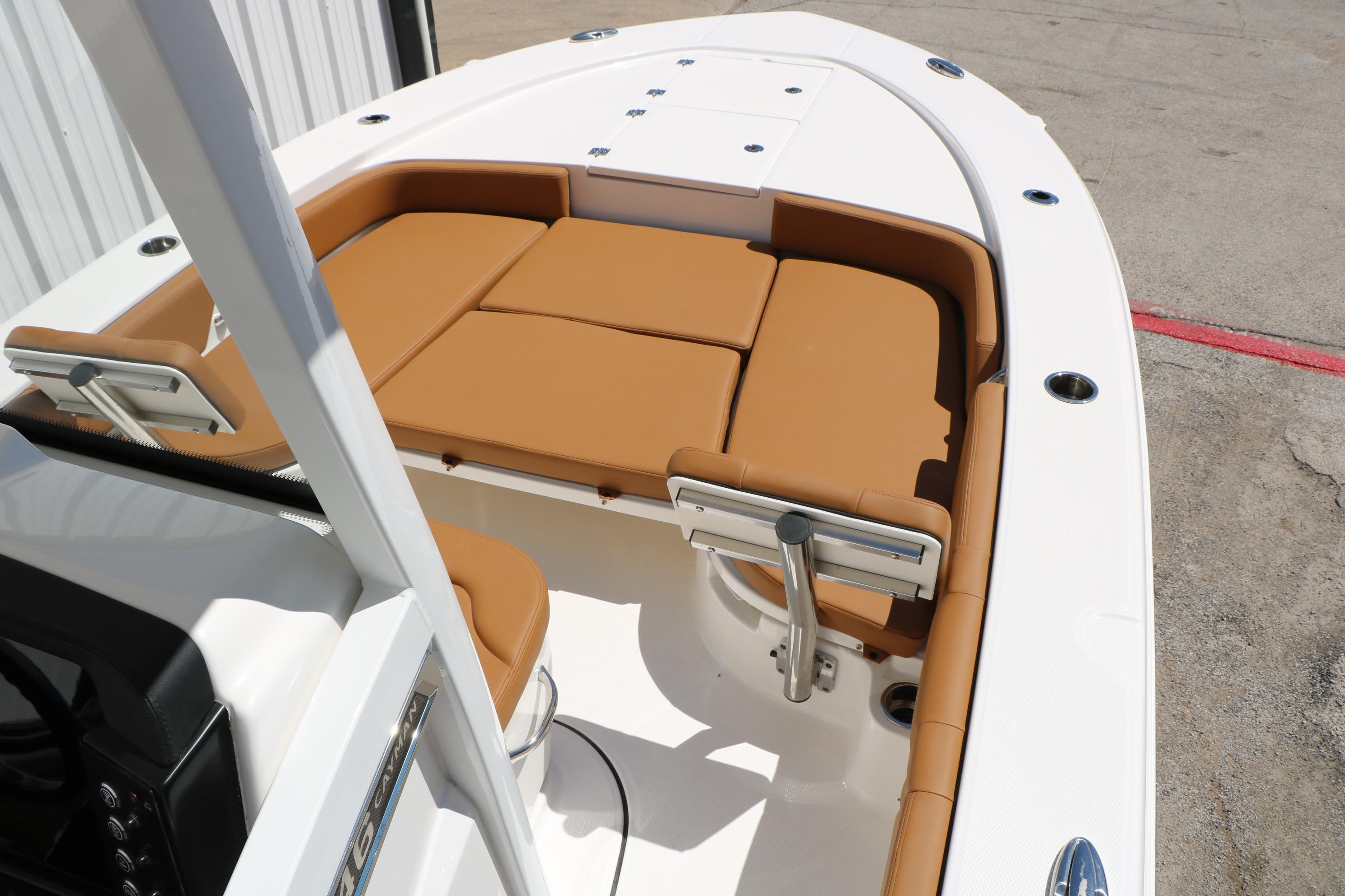 2026 Robalo 246 Cayman boat with tan seating and sleek white deck design.