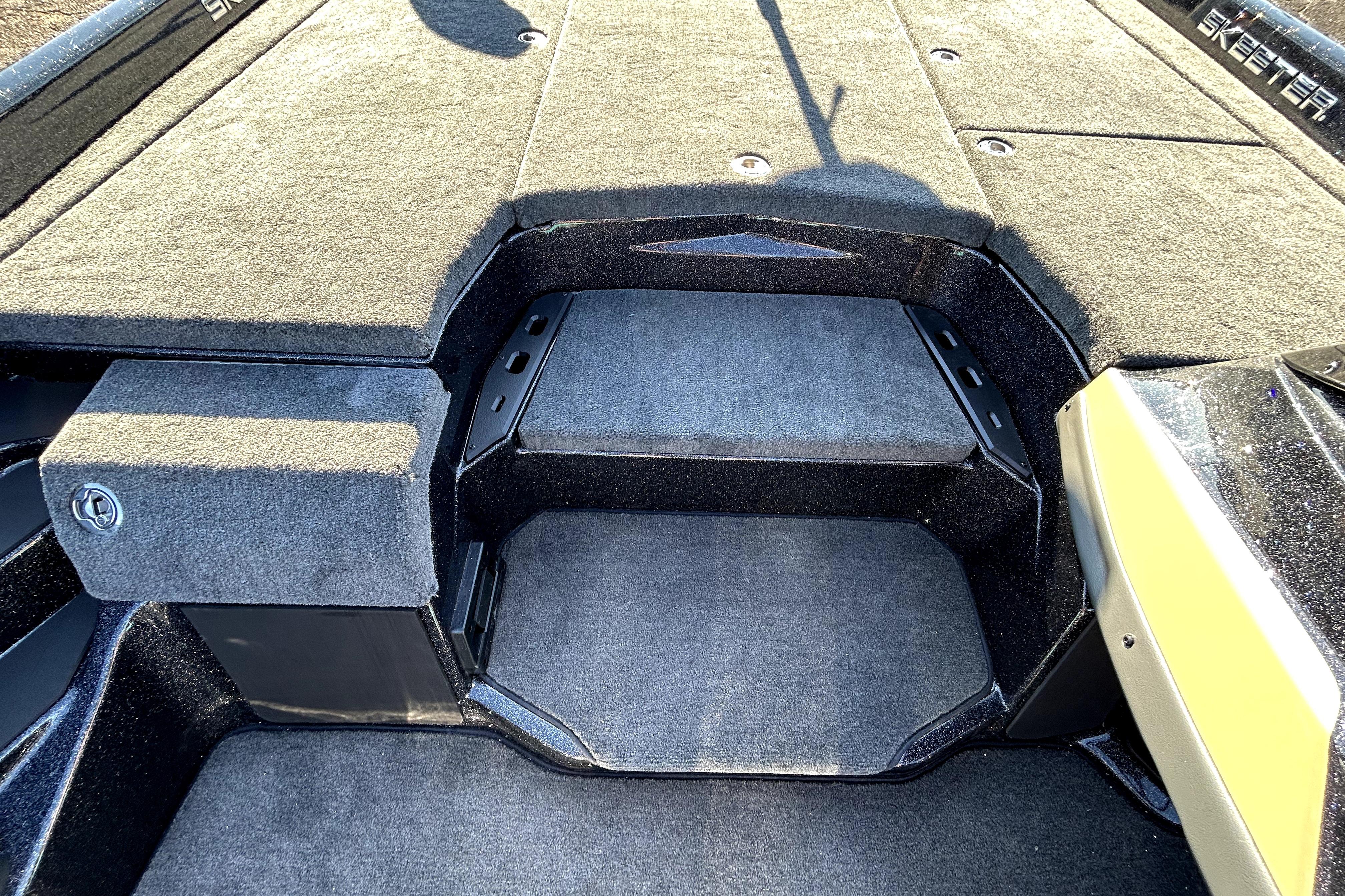 2026 Skeeter ZXE21 boat interior with carpeted deck and storage compartments.