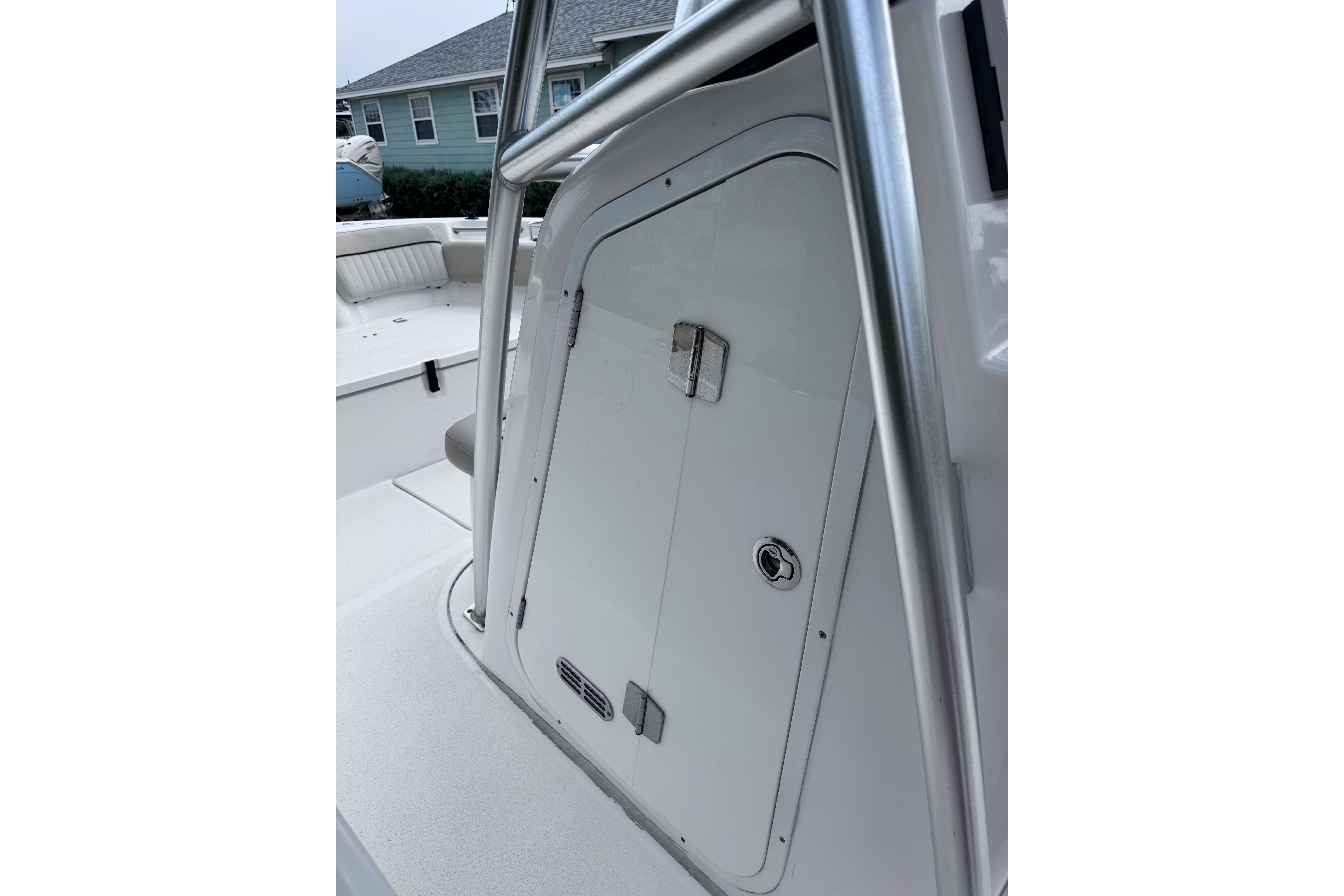 2018 Sea Fox 206 Commander boat interior with storage compartment and seating.