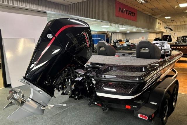 2026 Nitro Z20 XL Pro boat with powerful outboard motor in showroom setting.