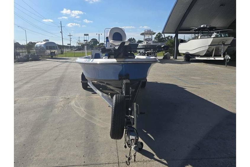 2020 Blue Wave 2400 PureBay boat on trailer in outdoor dealership lot.