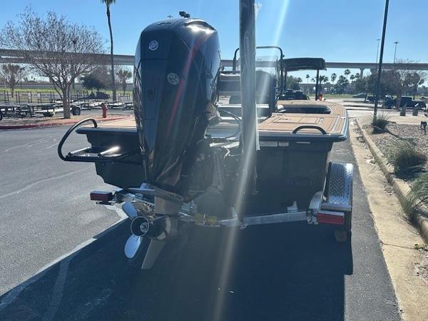 2025 Mako 18 Pro Skiff Backwater Edition with outboard motor on trailer.