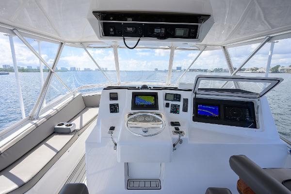 Helm of 2000 Viking 50 Convertible yacht with navigation equipment and ocean view.