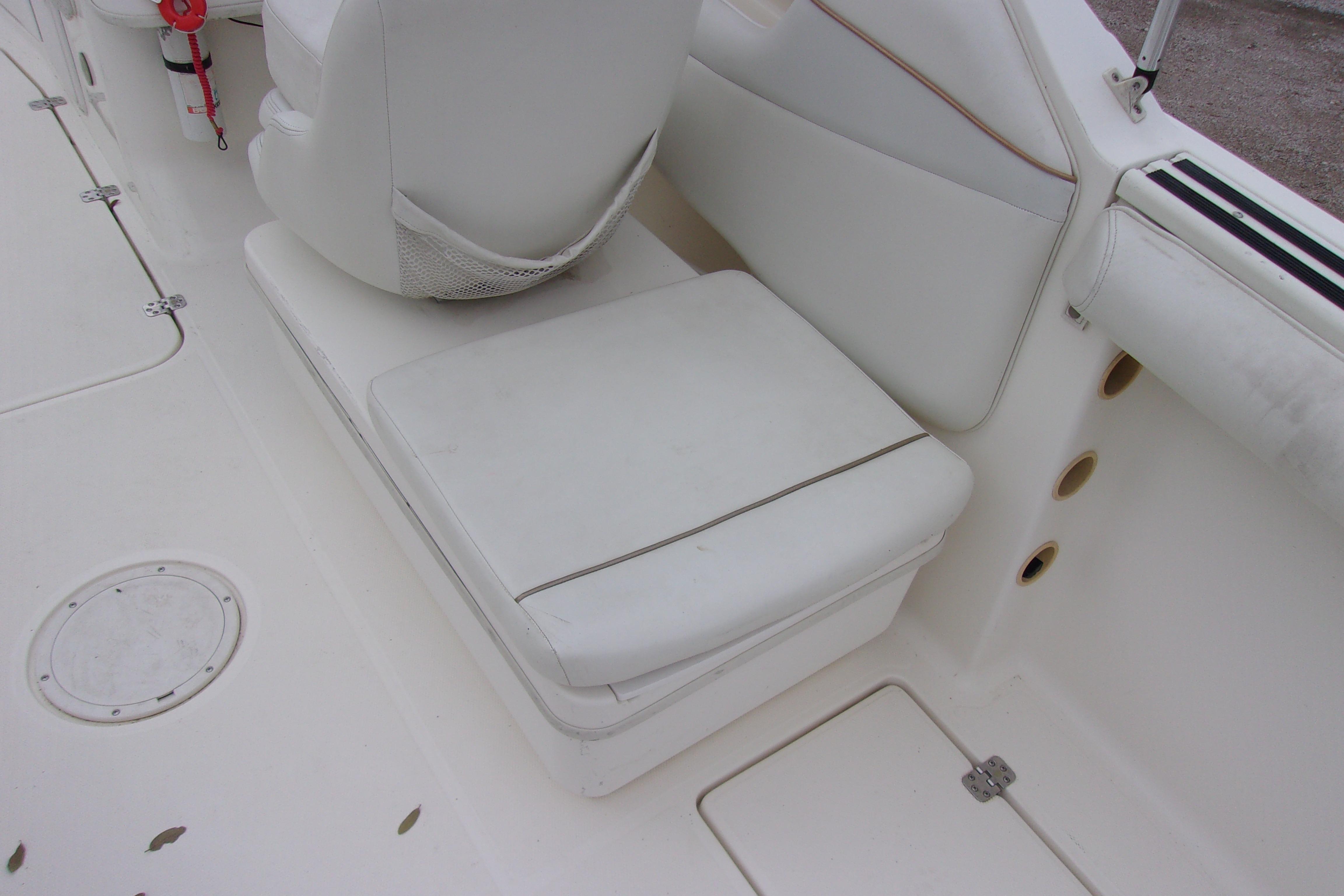 White seating area on a 1998 Wellcraft 210 Sportsman boat interior.