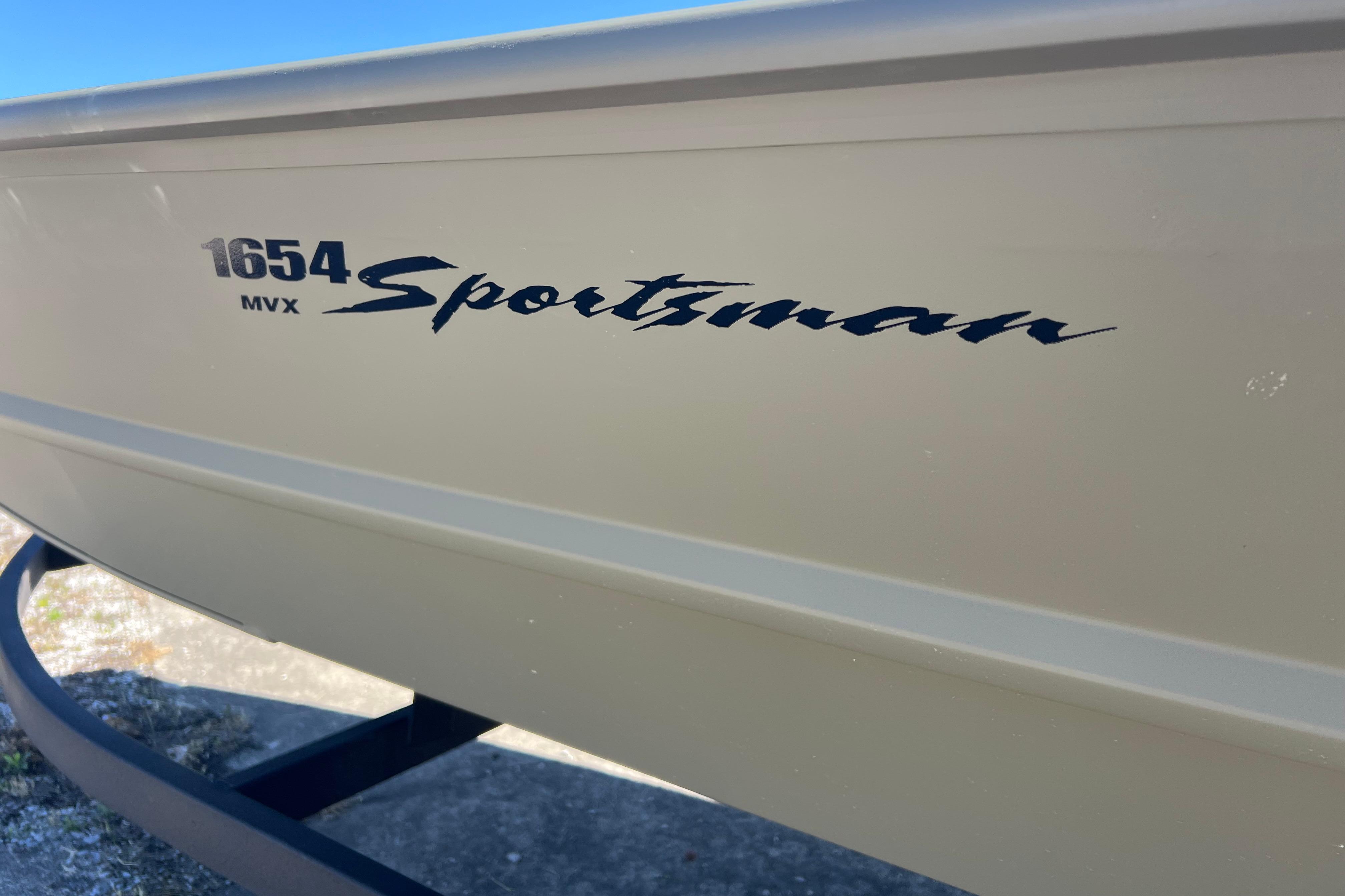 2026 Tracker Grizzly 1654 T Sportsman boat side view with model branding.