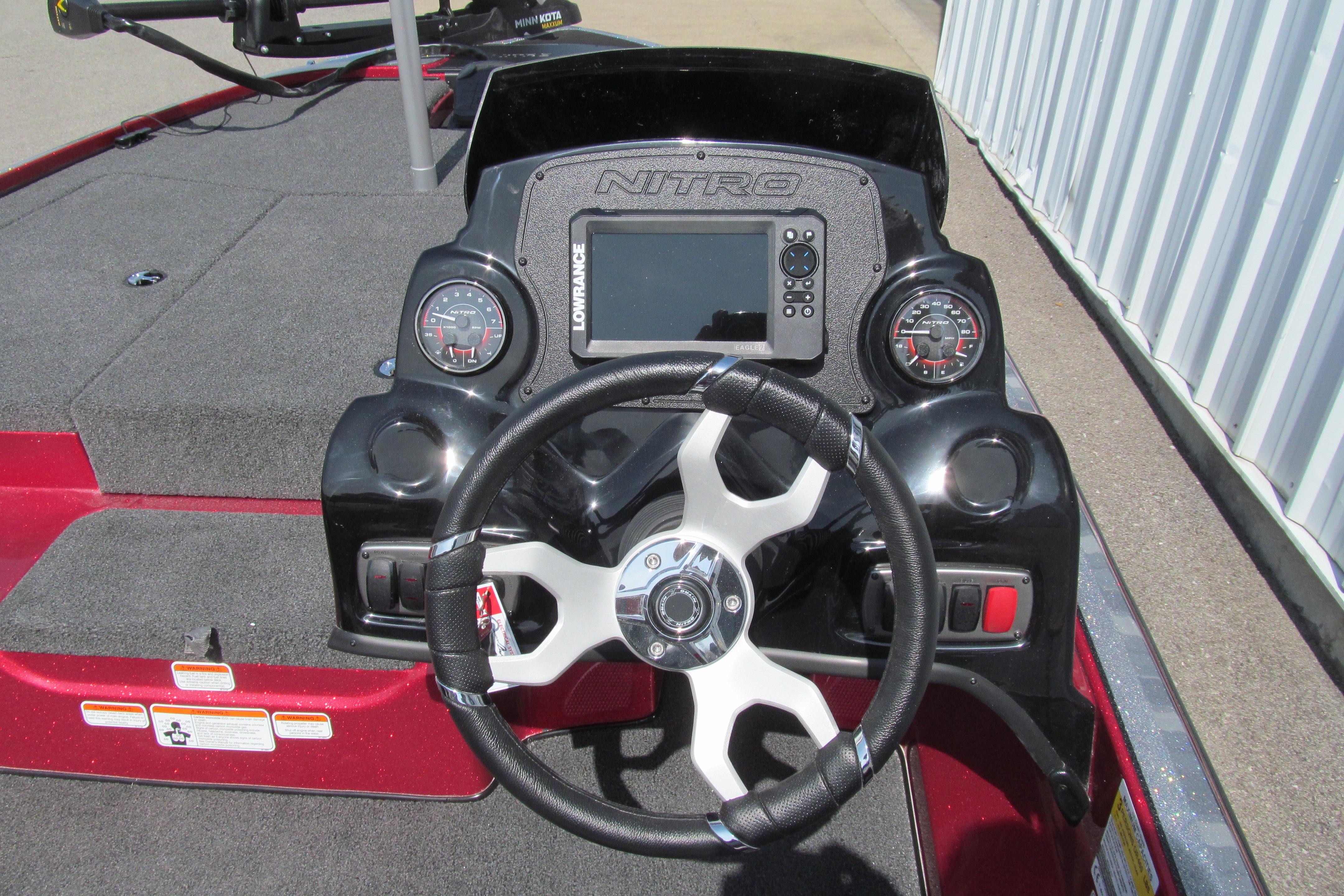 Steering console of a 2026 Nitro Z17 boat with gauges and Lowrance display.