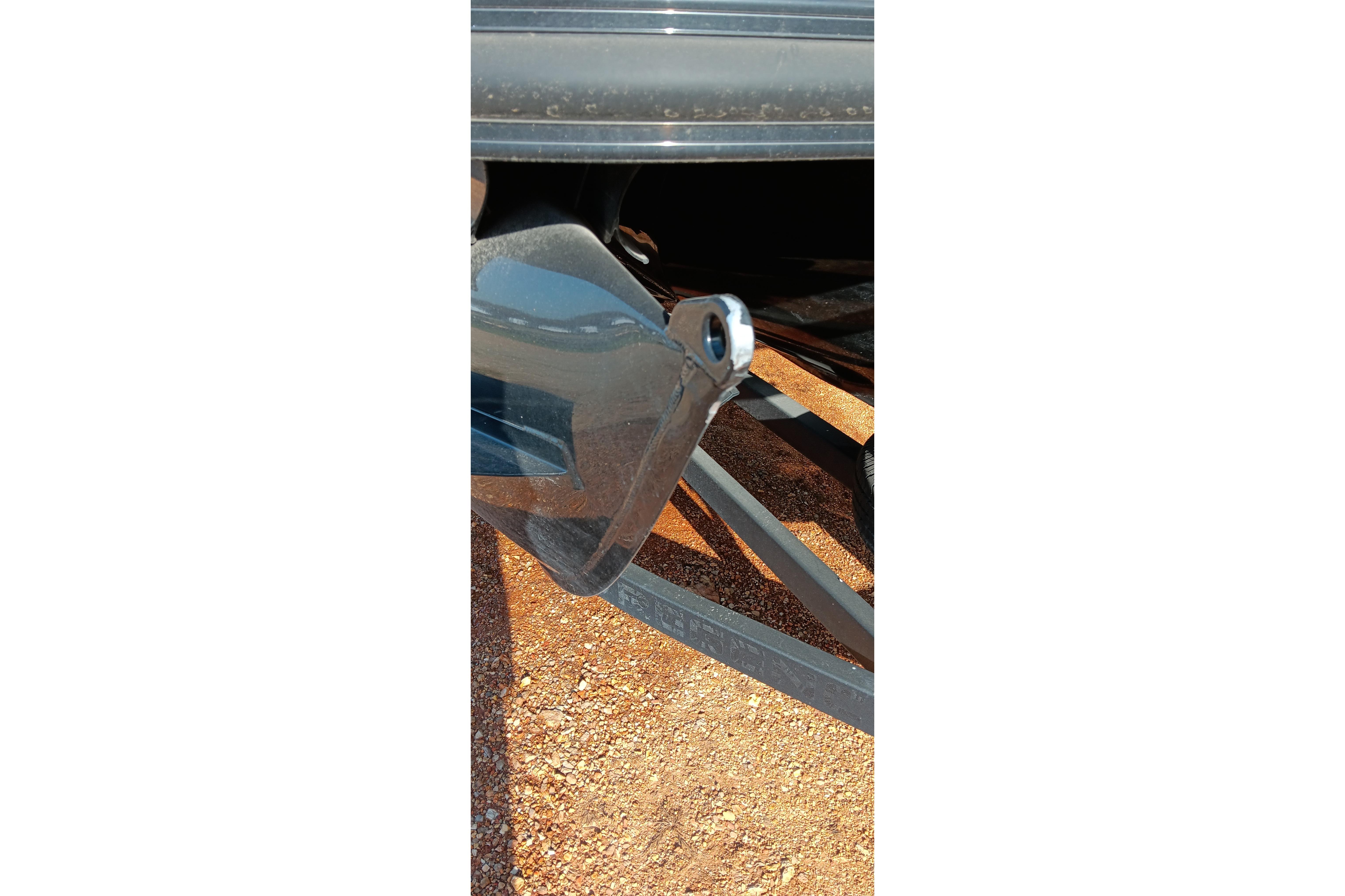 Close-up of a 2023 Ranger 2500LS boat propeller on a gravel surface.