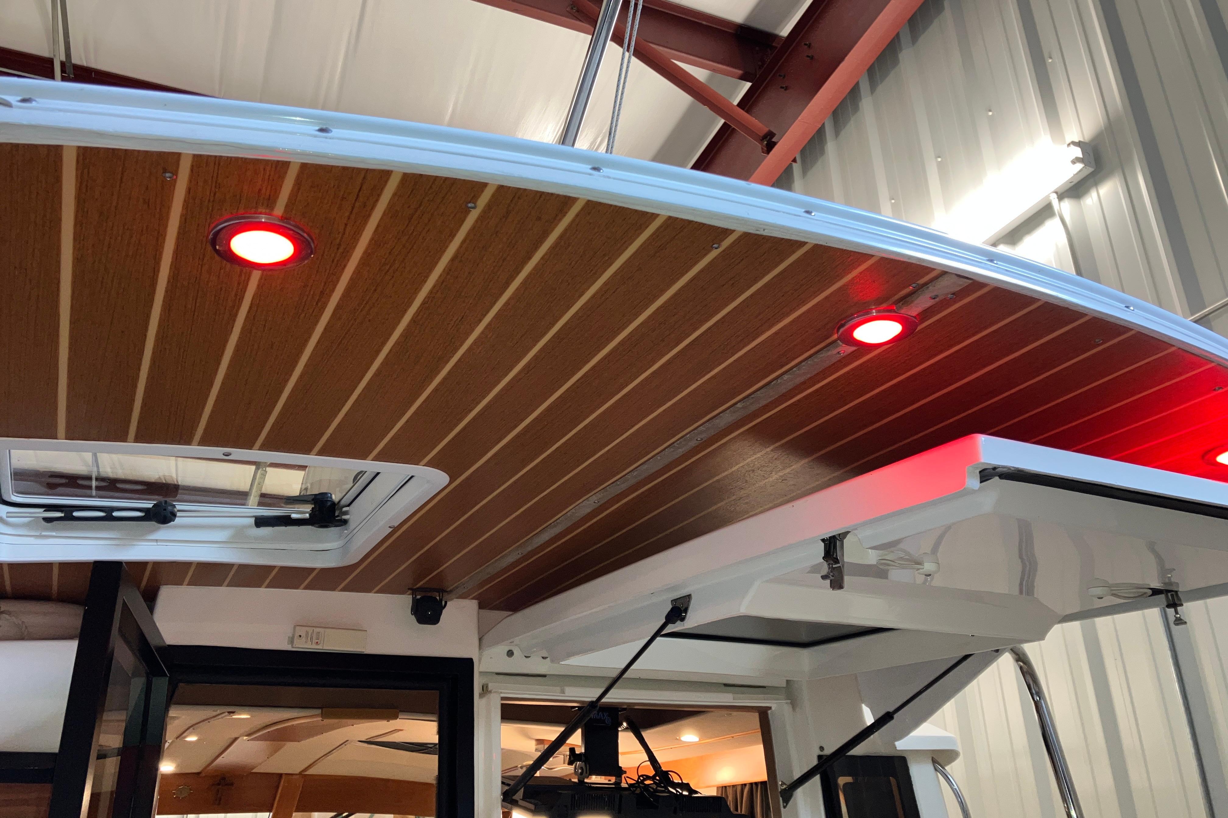 2017 Cutwater C-30 Sedan boat interior with wood ceiling and red LED lights.