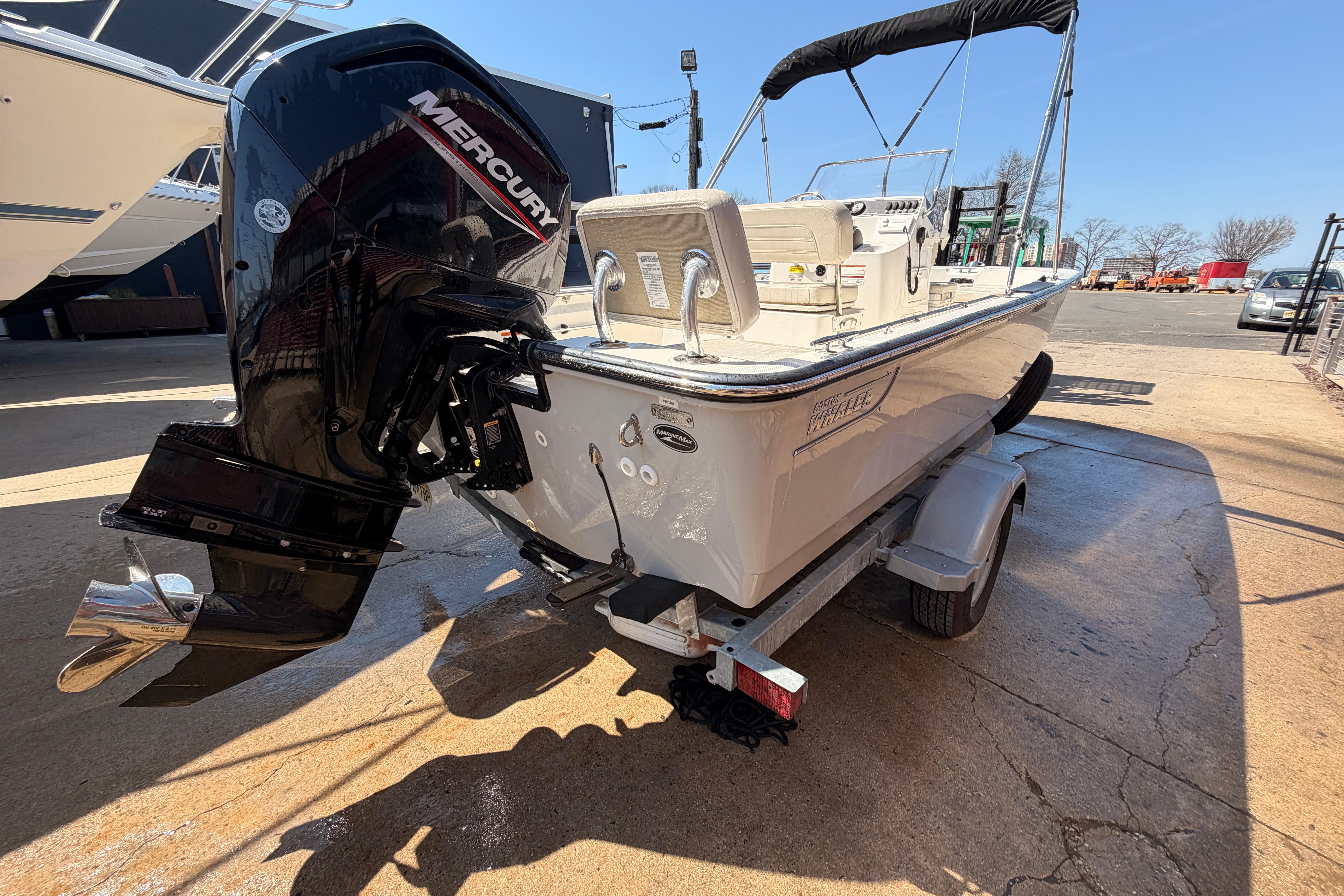 2024 Boston Whaler 170 Montauk boat with Mercury engine on trailer.