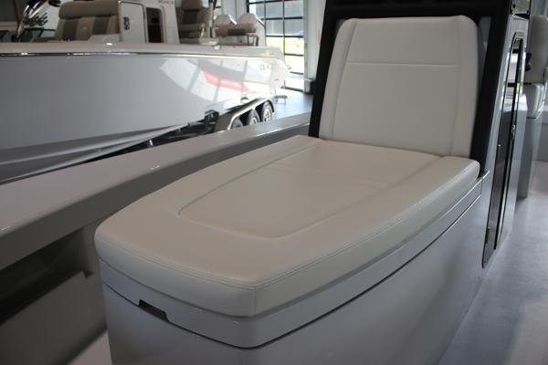 2025 East Cape 25 Open boat interior with white cushioned seating.