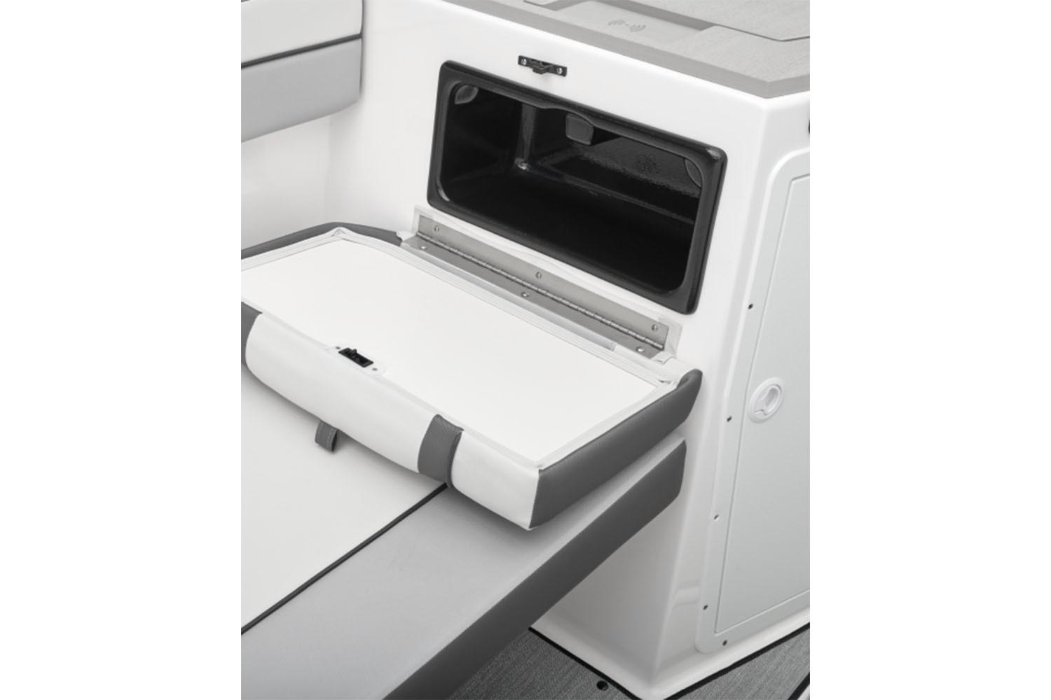 2026 Yamaha Boats AR220 interior storage compartment with open hatch and cushioned seating.