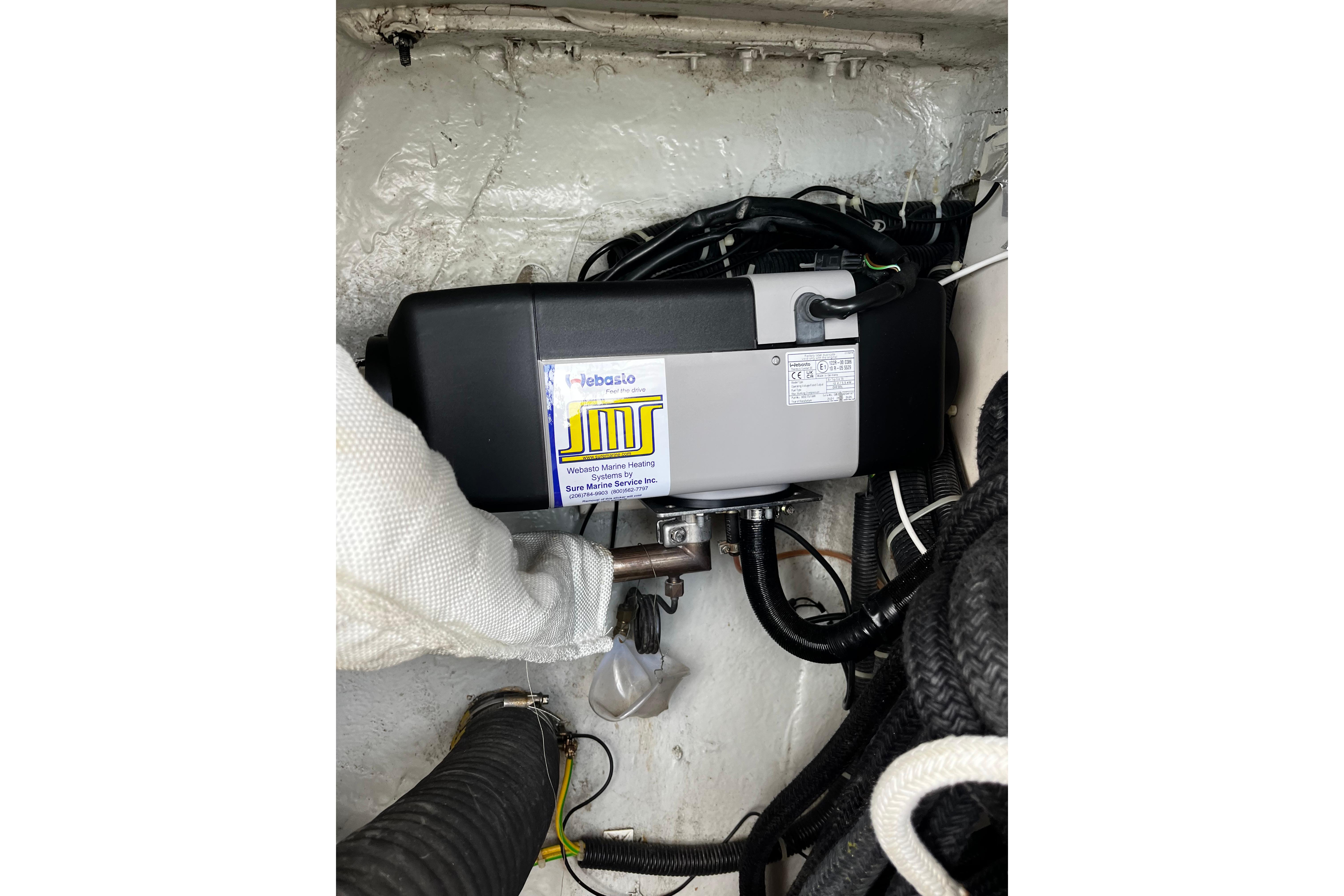 Marine heater installation in a 2004 Hanse 411 yacht engine compartment.