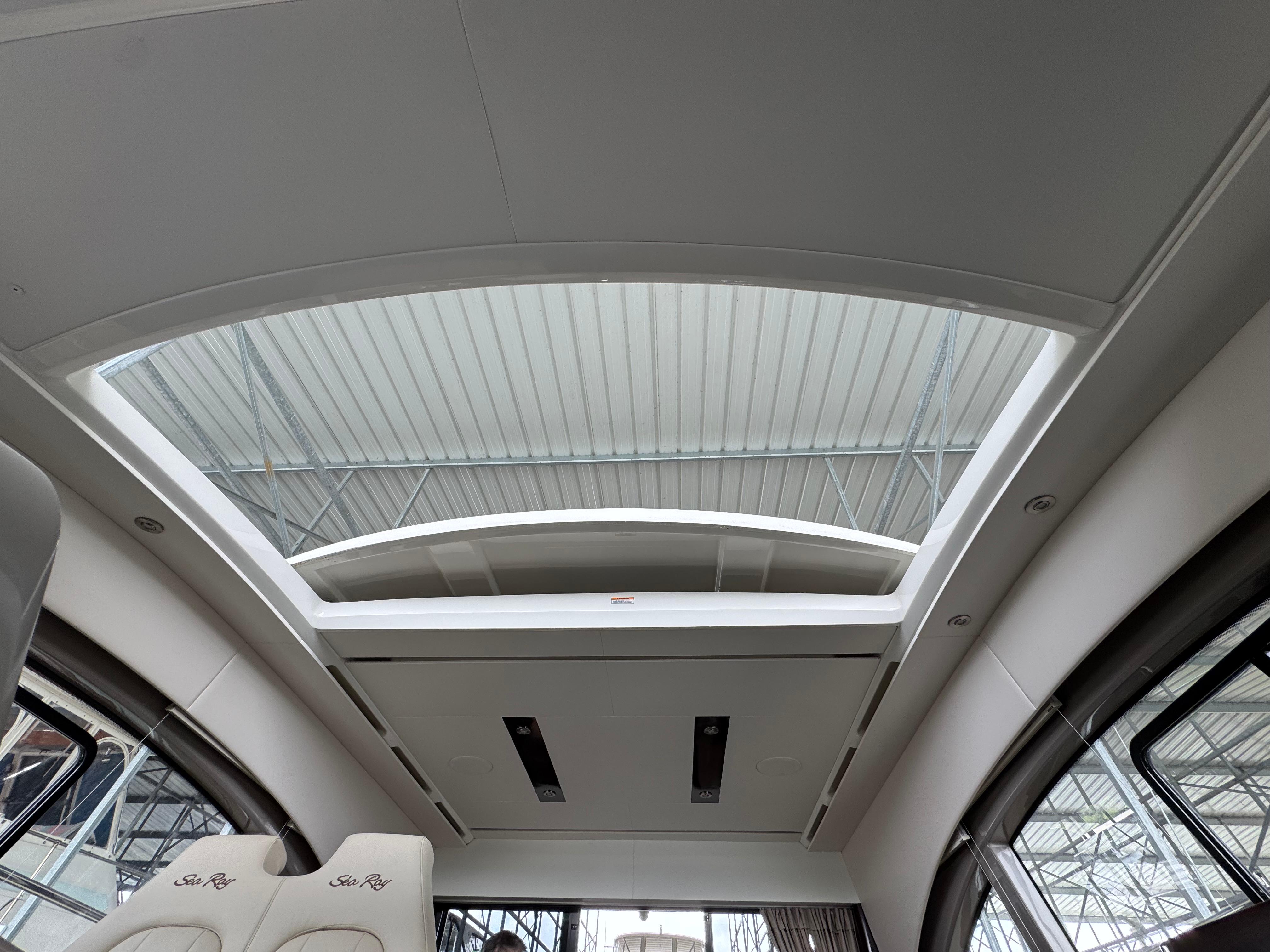 2017 Sea Ray Sundancer 400 interior with sunroof and luxurious seating.