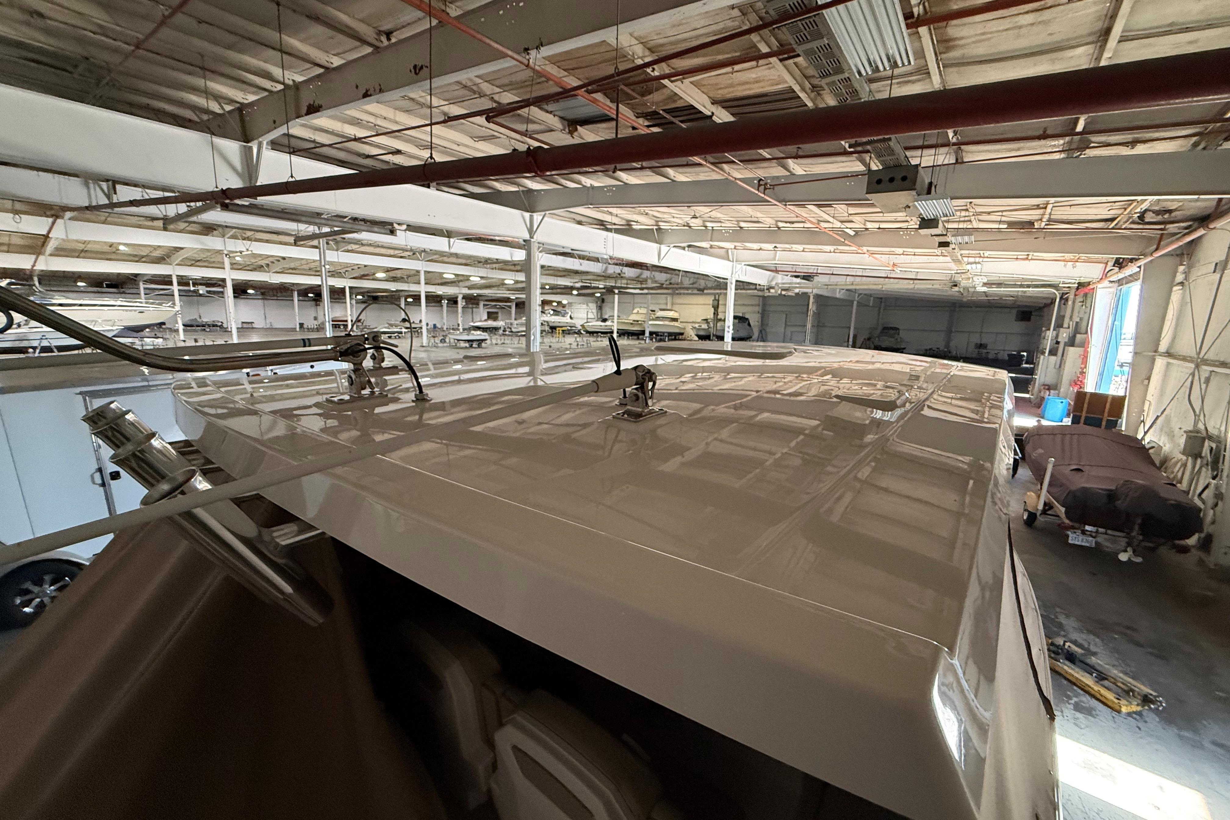 2021 Pursuit S 268 Sport boat in a spacious indoor storage facility.