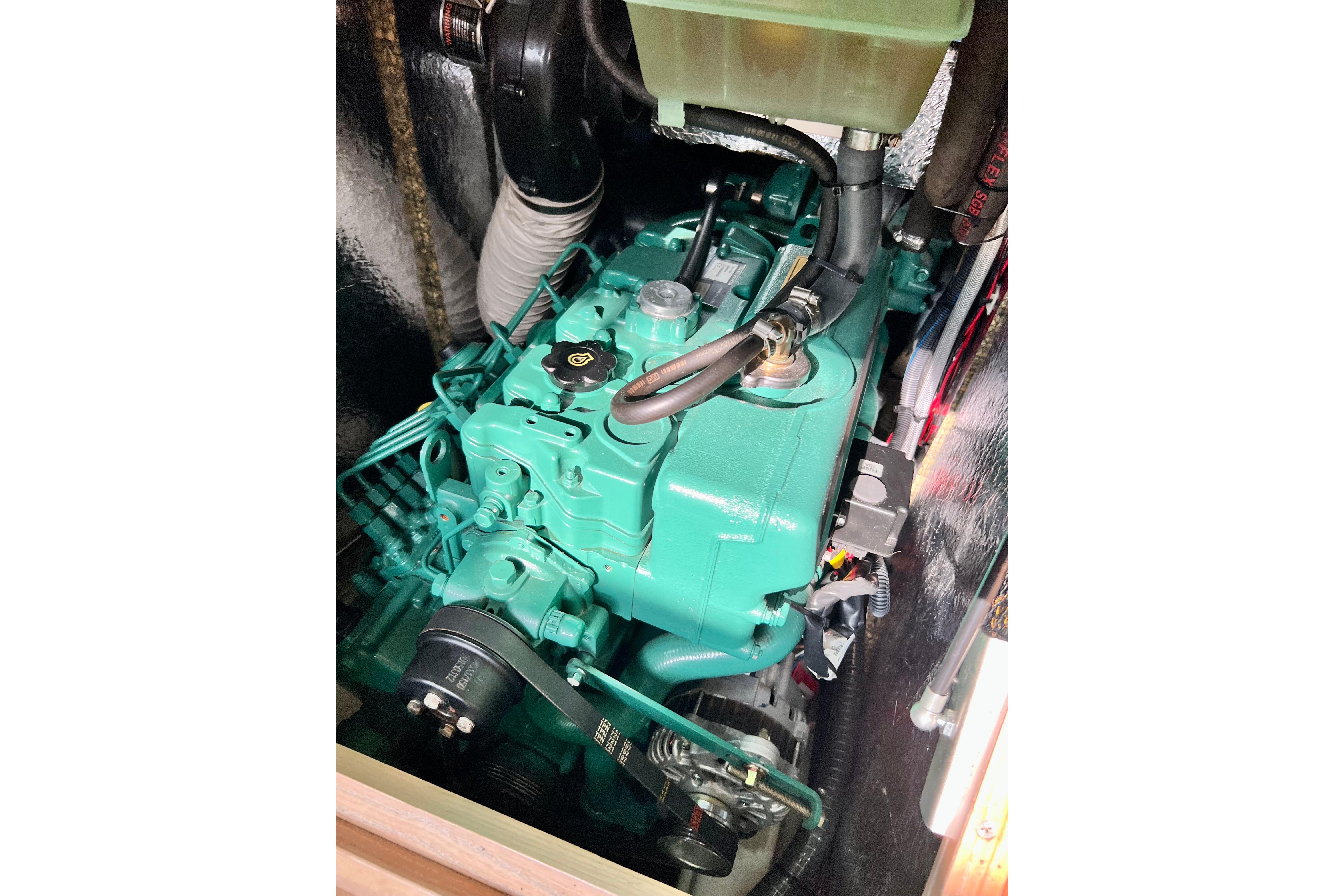 Engine compartment of a 2016 Hanse 455 yacht, showcasing a green marine engine.