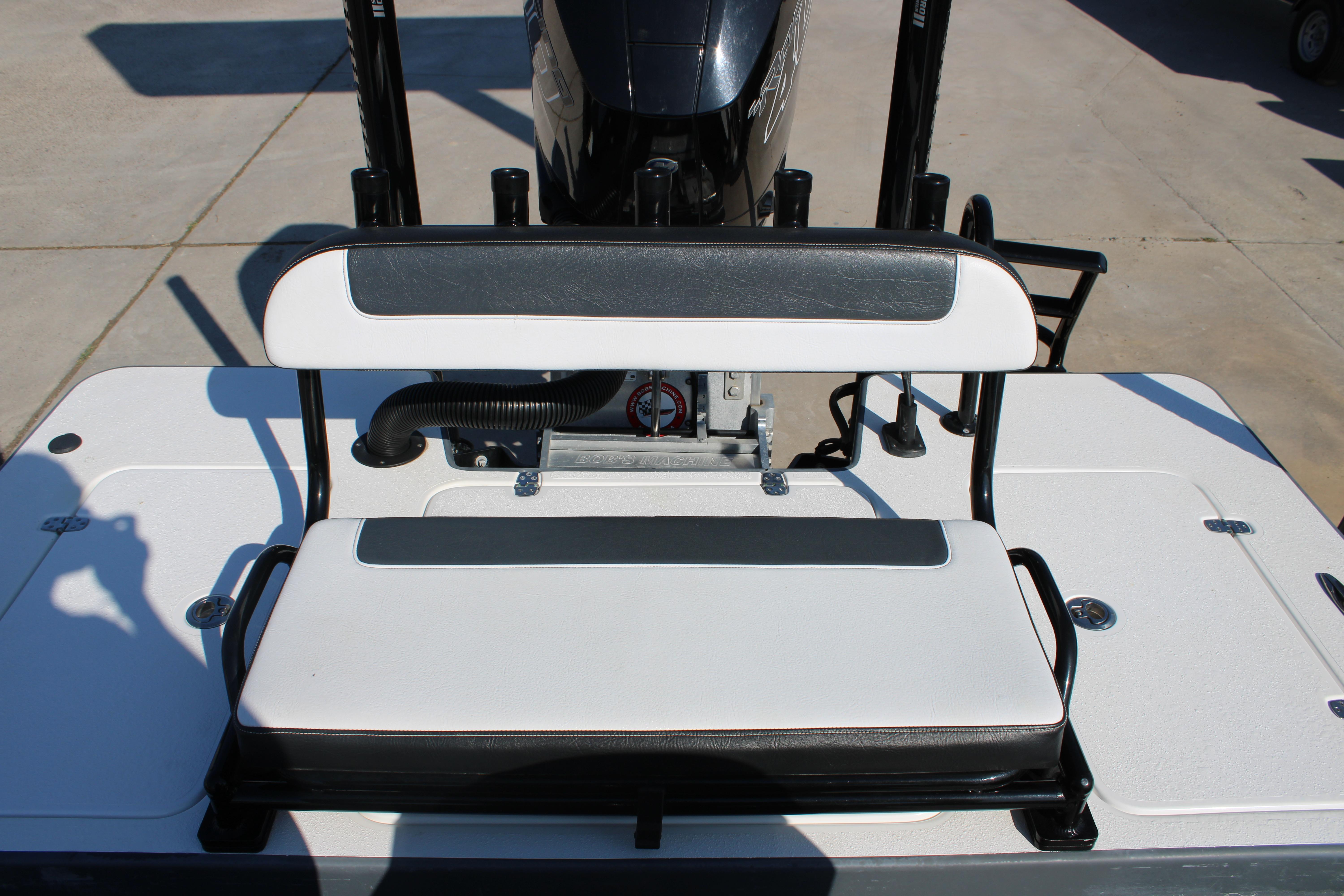 2023 Mamba 24VX boat seat with black and white upholstery, outdoor setting.