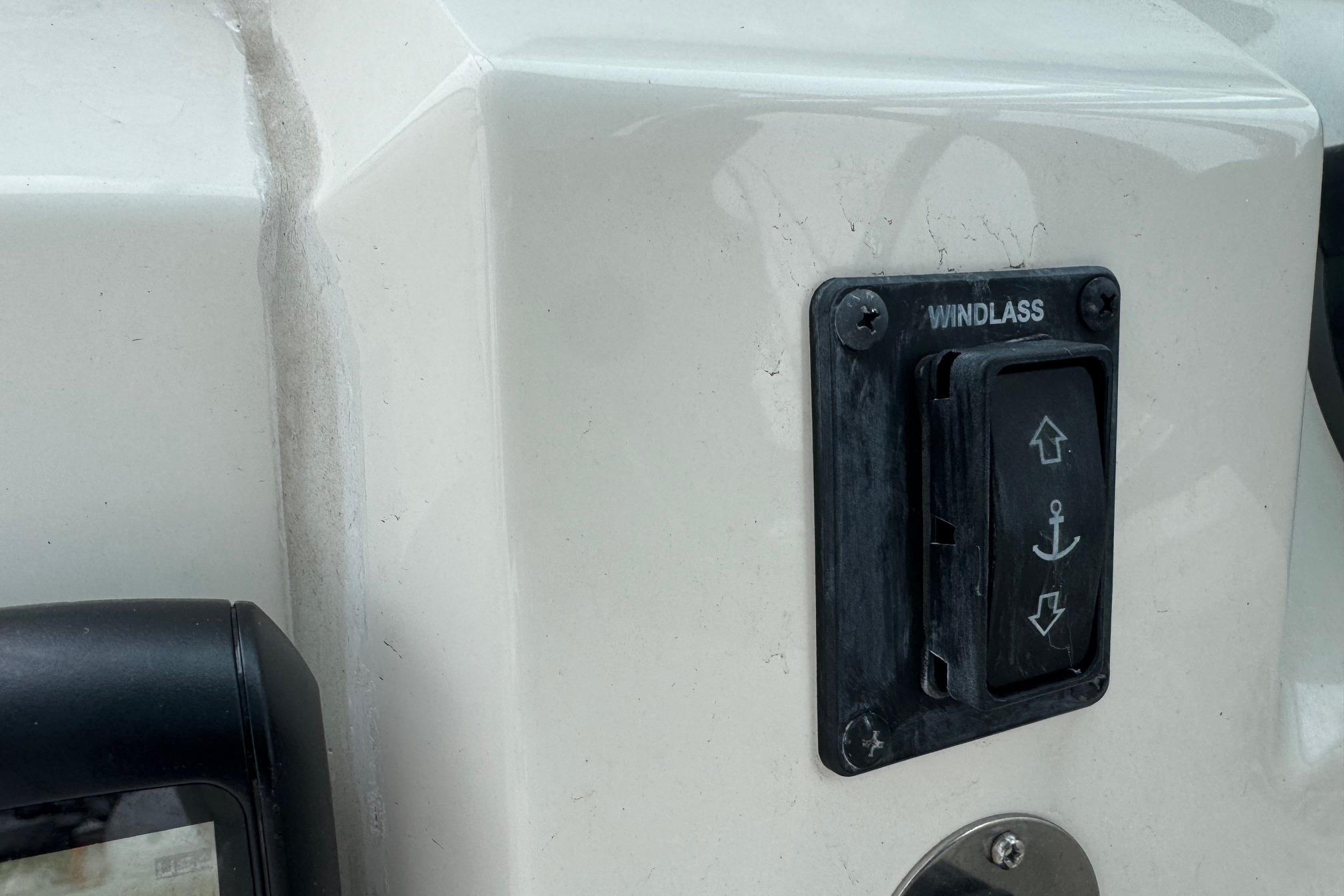2024 Cobia 240 Dual Console windlass control switch on boat dashboard.