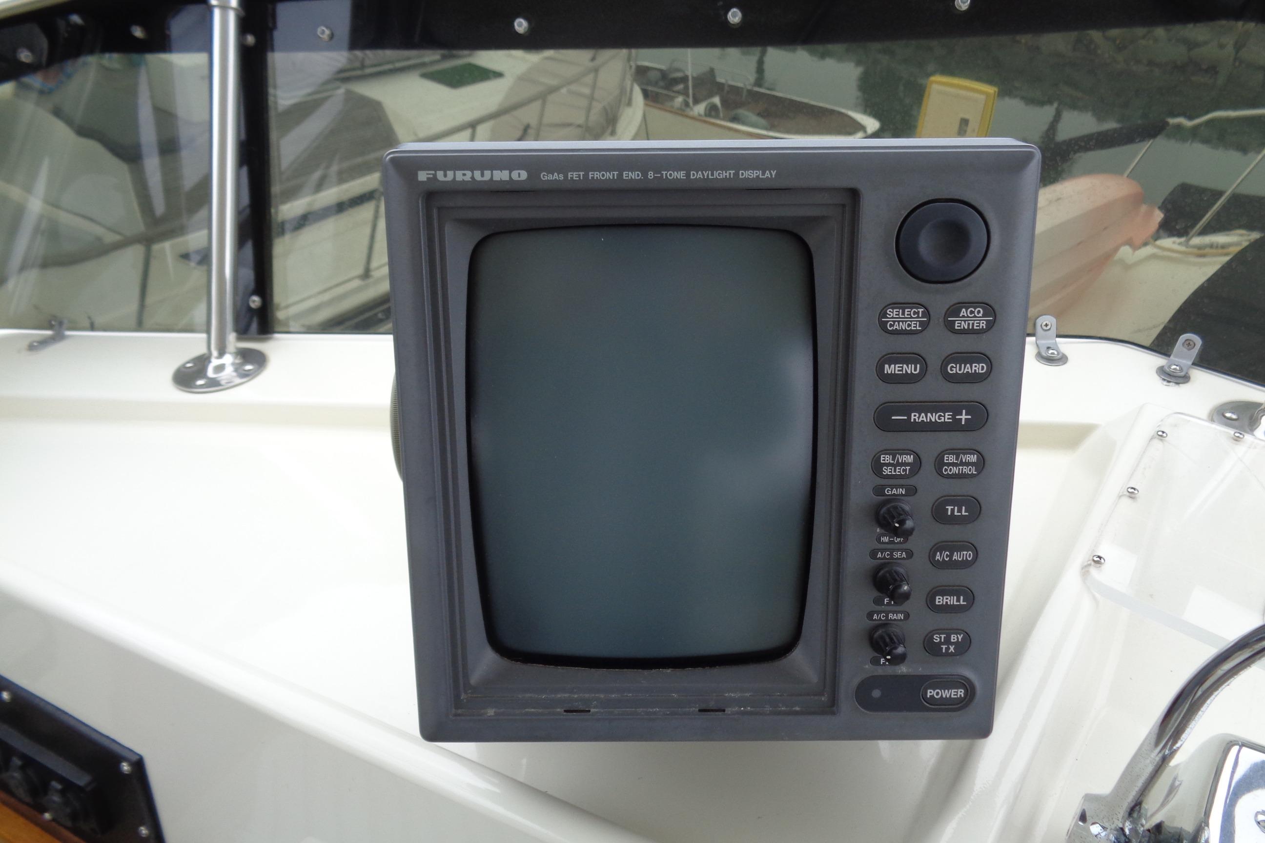 Furuno marine display on 1981 Hatteras 48 Cockpit Motor Yacht dashboard.