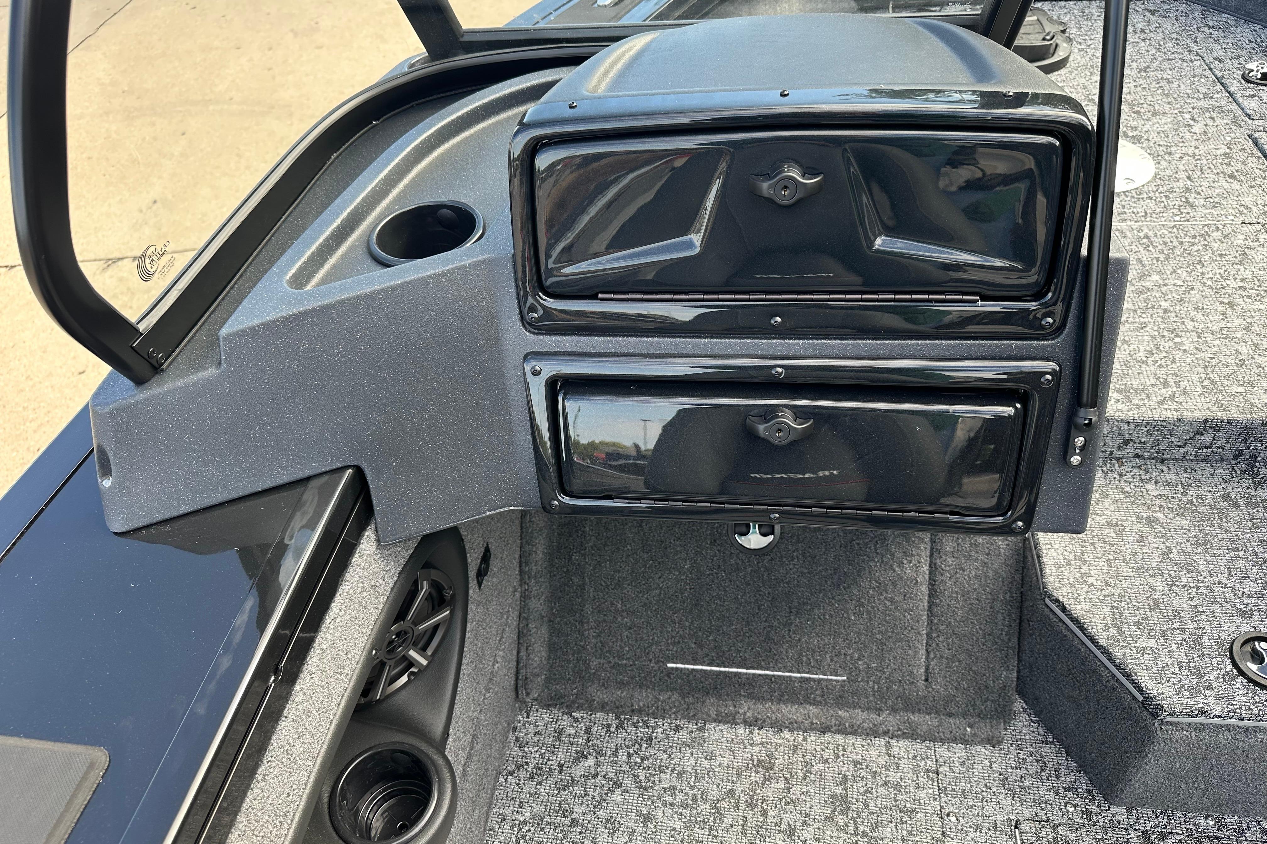 2026 Tracker Targa V-19 WT boat interior with storage compartments and cup holders.