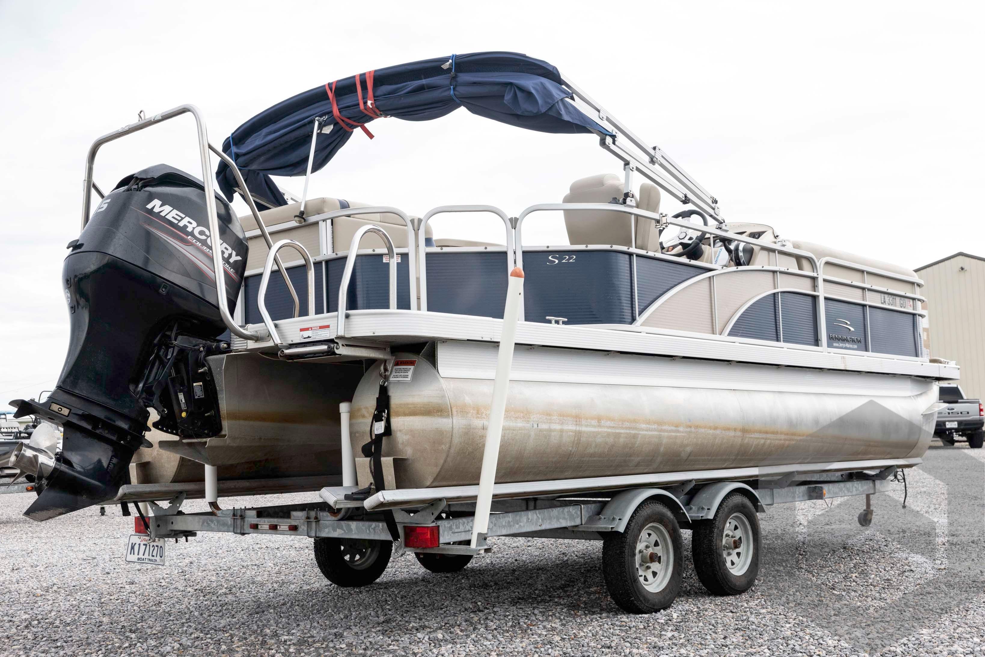 2014 Bennington 22 SLX pontoon boat on trailer with Mercury outboard motor.