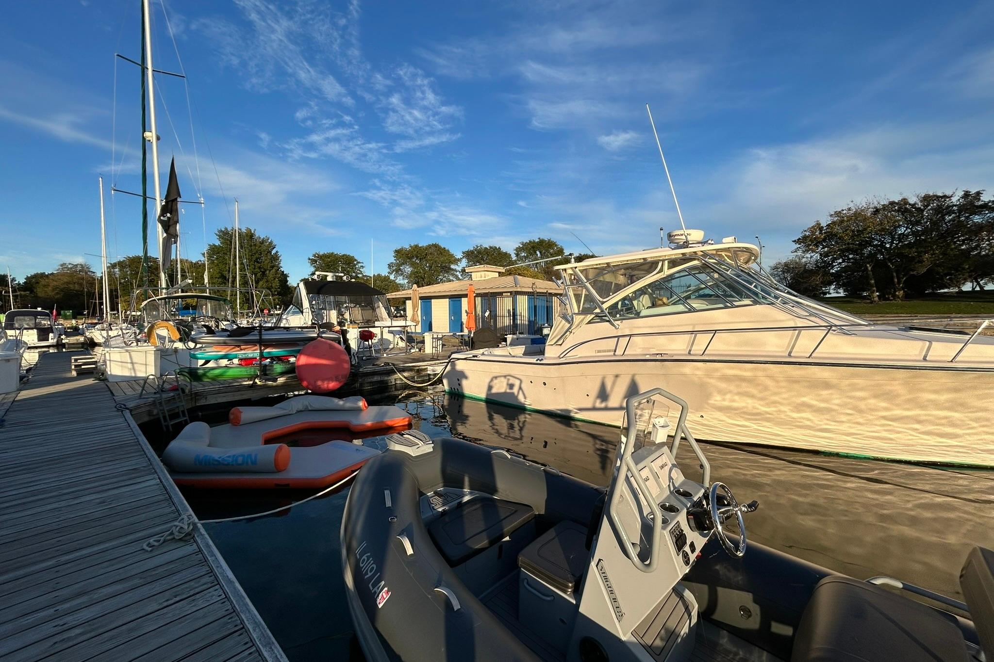 2007 Grady-White Express 360 docked at marina under clear blue sky.