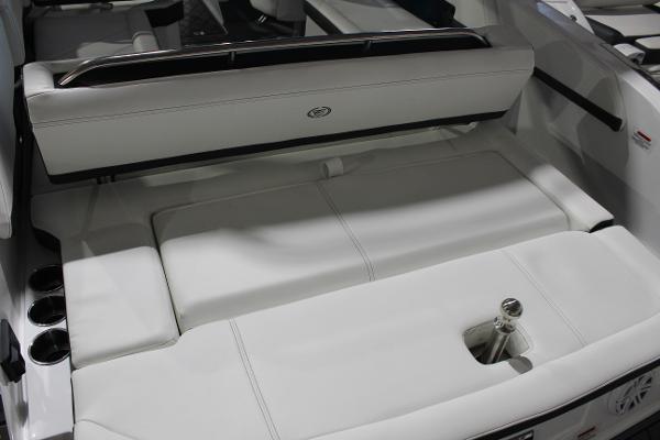 2025 Cobalt R6 boat interior with white seating and cup holders.
