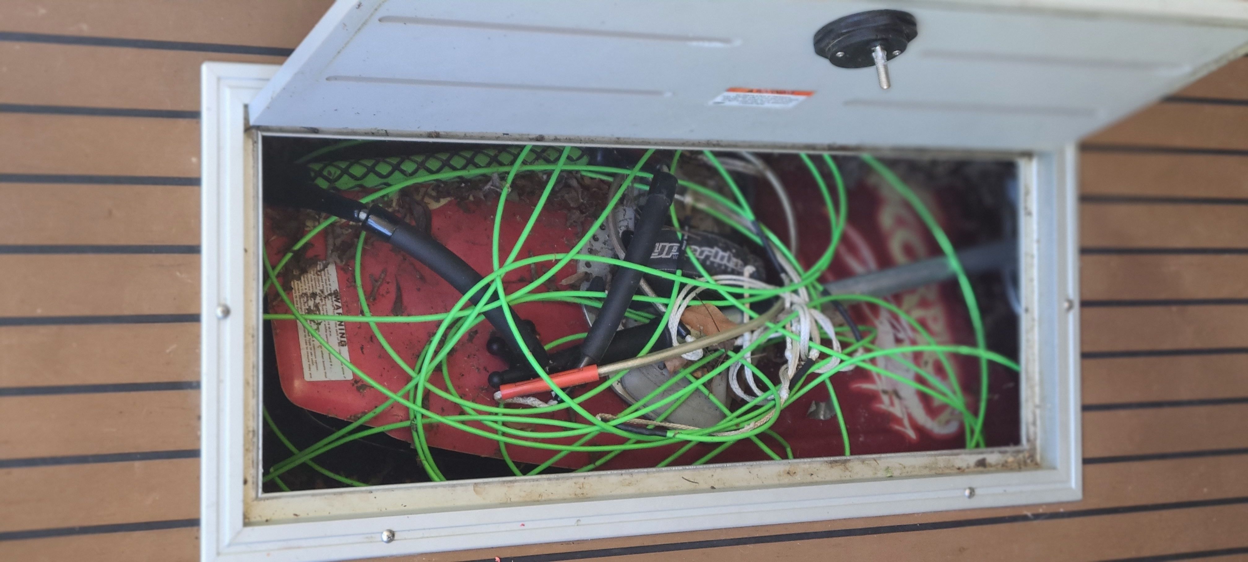 Storage compartment in 2009 Premier 275 Grand Majestic LTD with cables.
