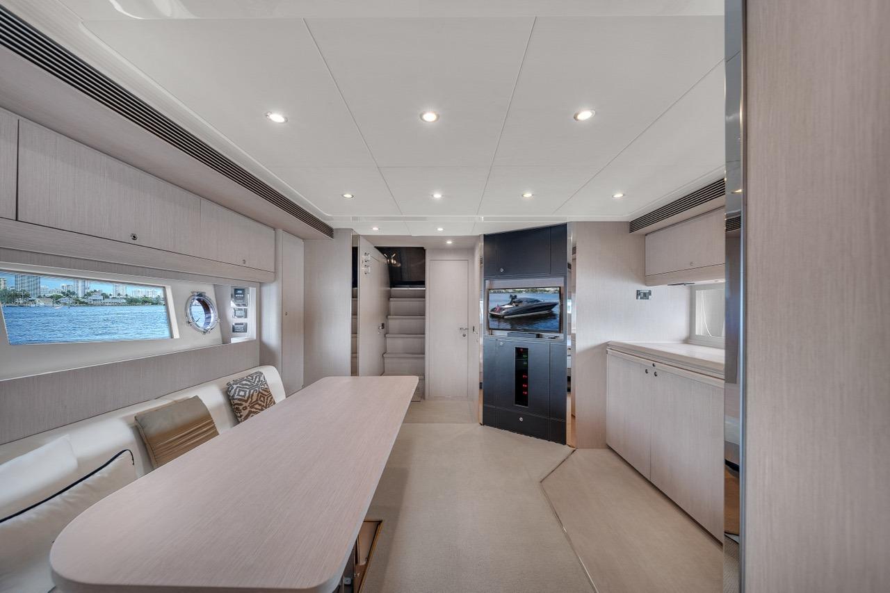 Luxurious interior of 2015 Riva 63 yacht with modern design and elegant furnishings.