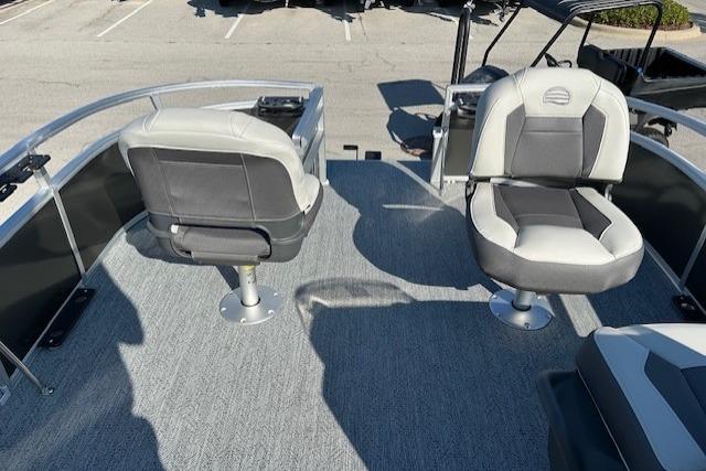 2026 Sun Tracker Bass Buggy 16 XL Select pontoon boat with two swivel seats on deck.