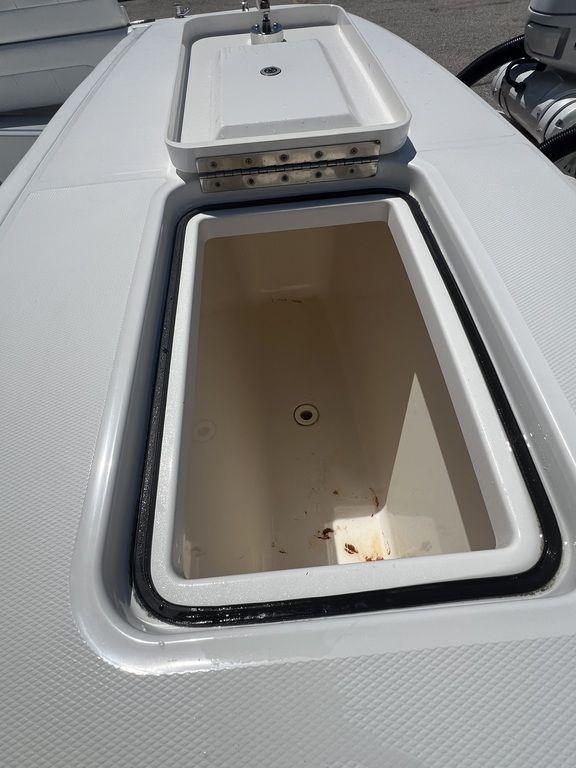Open storage compartment on 2021 Regulator 41 boat deck.
