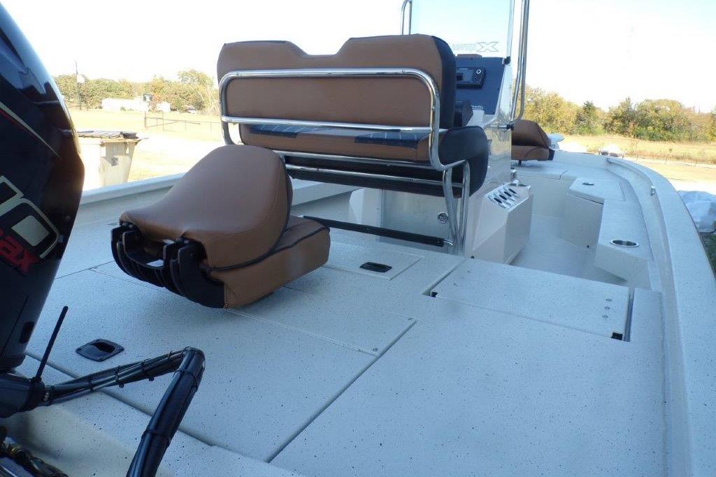 2026 Xpress H20B Bay boat interior with seating and storage compartments.
