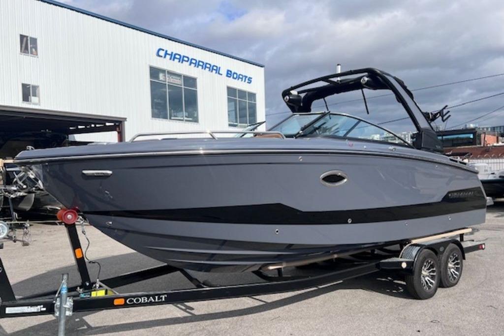 2025 Chaparral 2870 SSX boat on trailer at Chaparral Boats dealership.