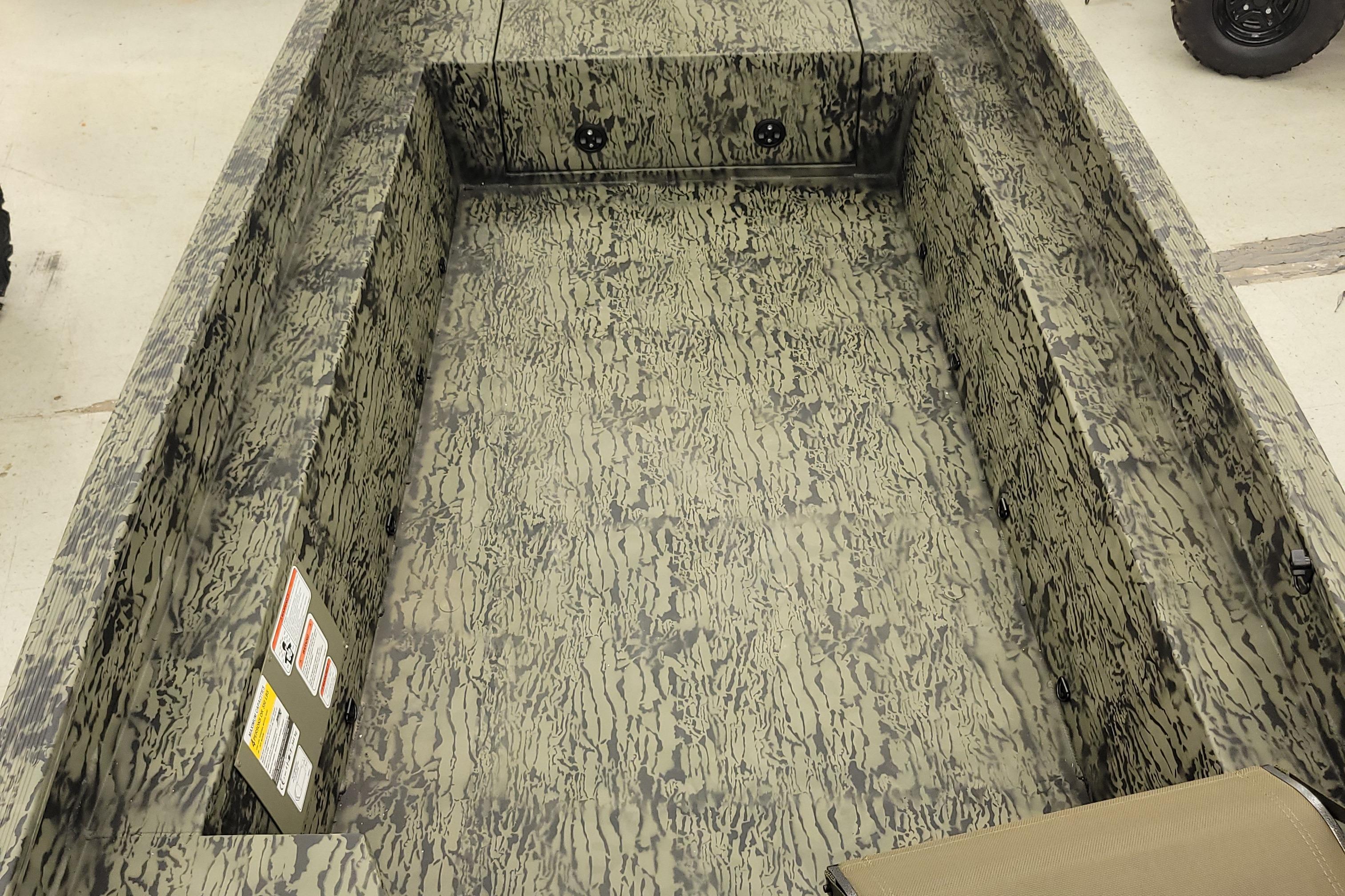 2026 Tracker Grizzly 1650 T Prairie Wings Edition boat interior with camouflage design.