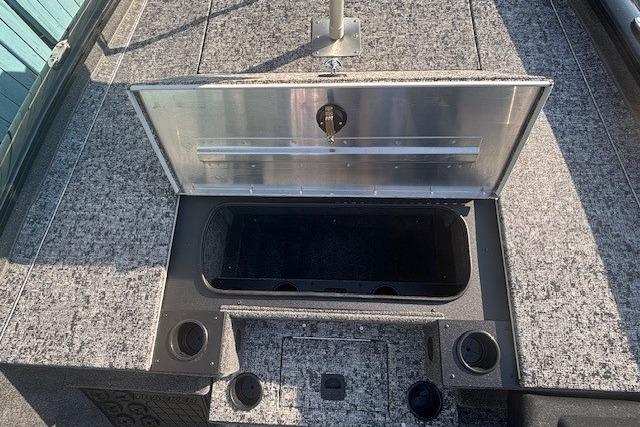 2026 Tracker Pro Team 195 boat storage compartment with open lid, showcasing interior space.