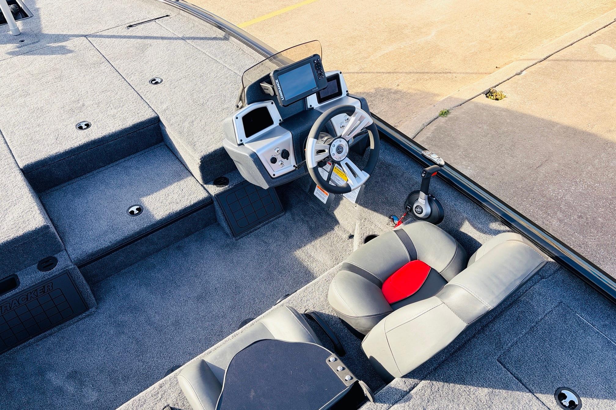 2025 Tracker Savage 215 boat interior with steering wheel and seating.