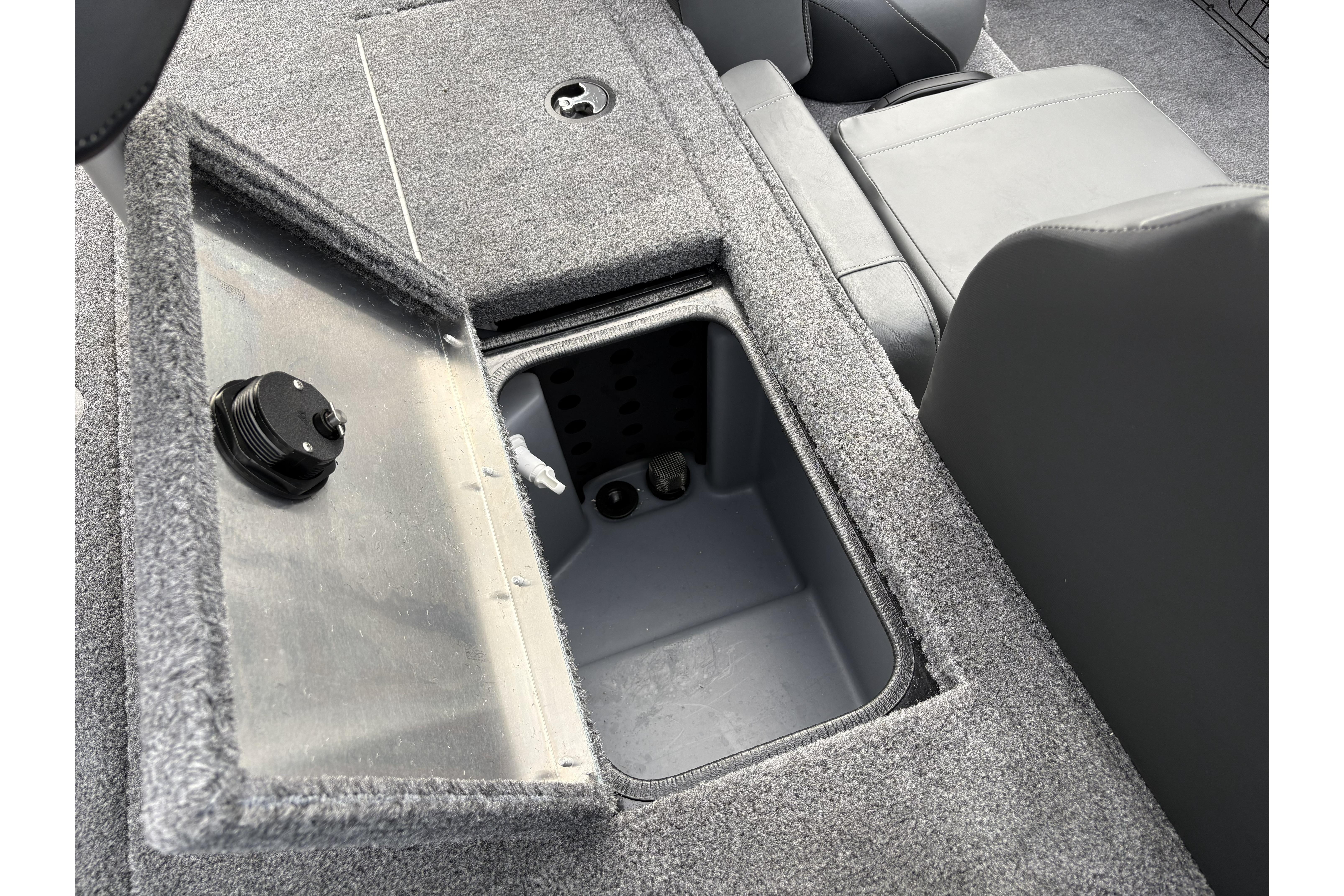 2026 Tracker Pro Team 195 boat storage compartment with open lid, showcasing interior space.
