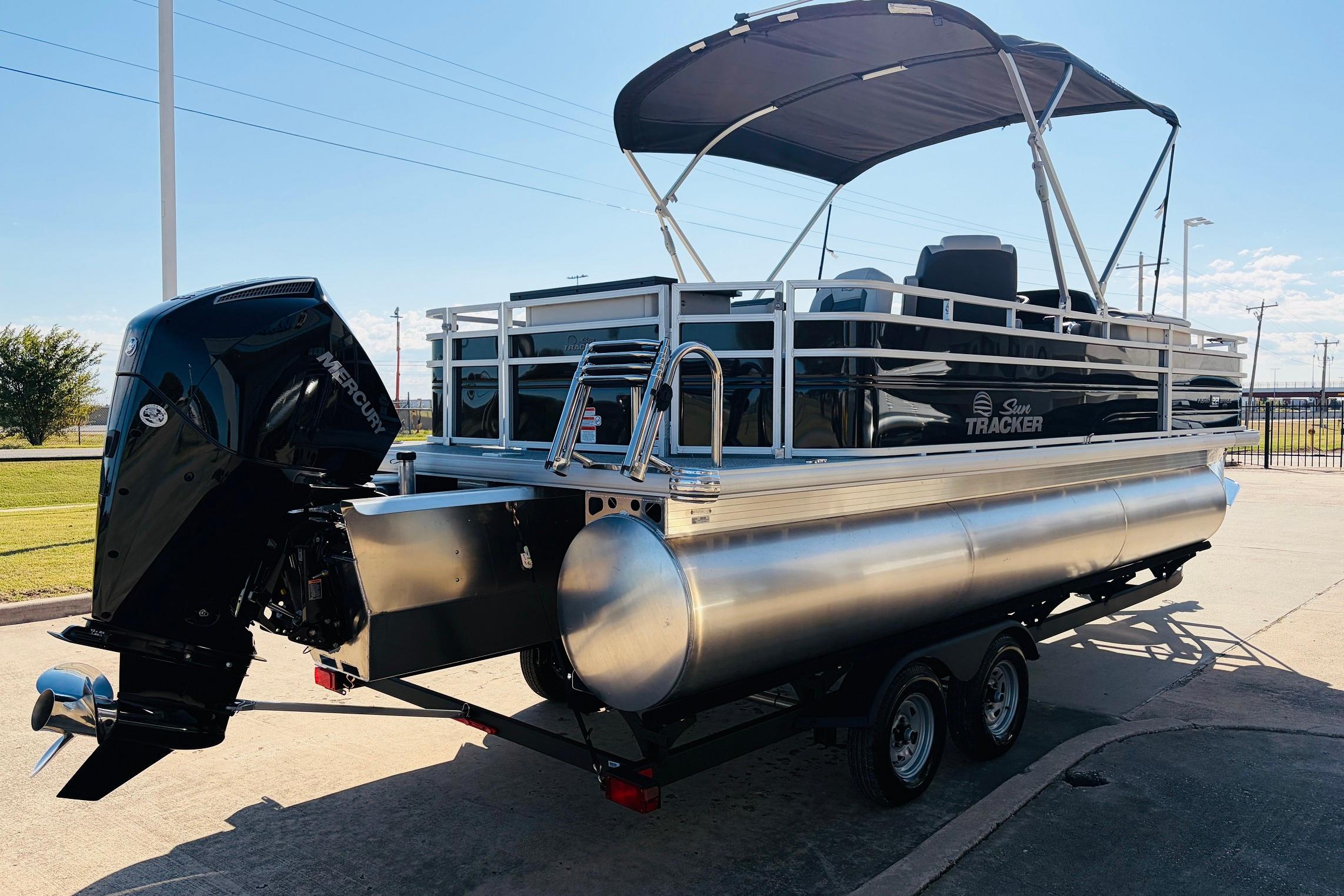 2026 Sun Tracker Fishin' Barge 22 XP3 pontoon boat with Mercury outboard motor.