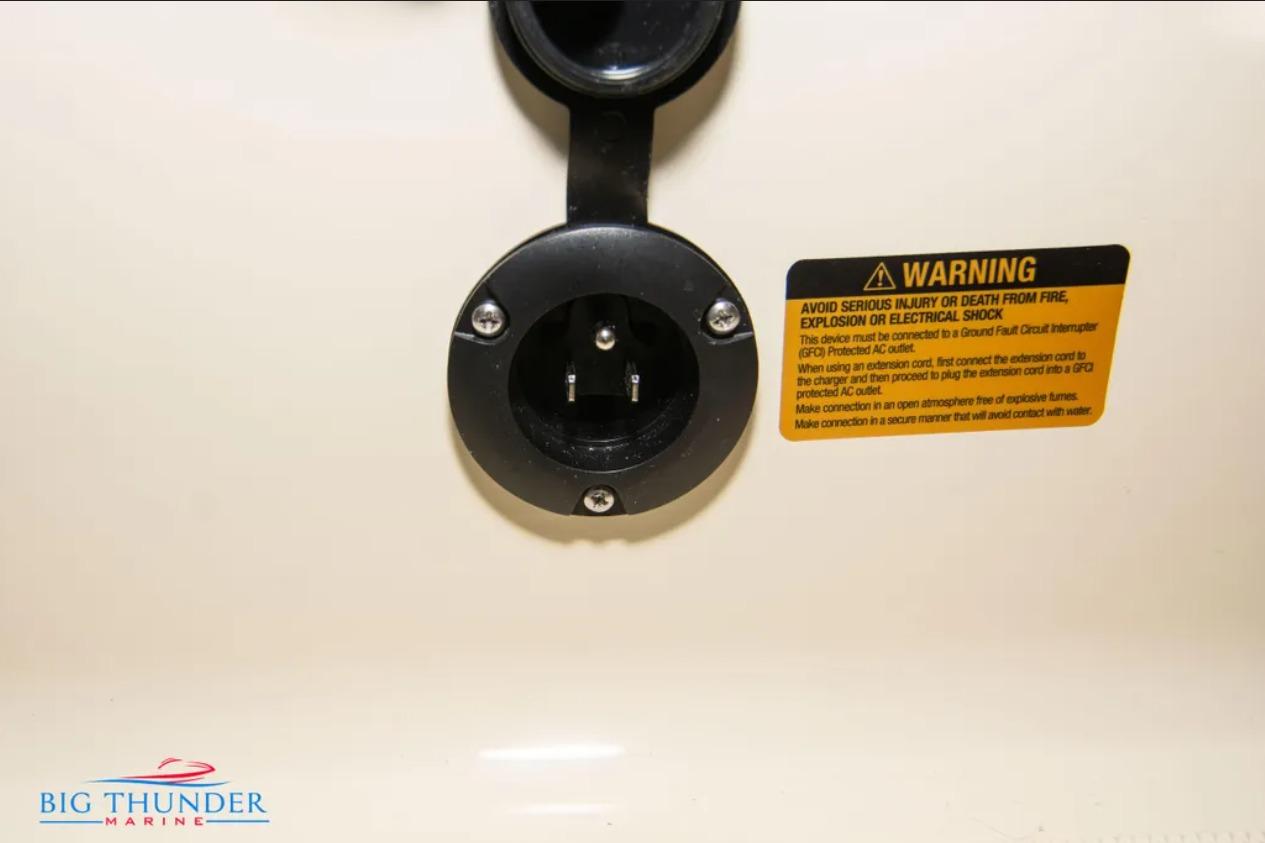 2024 Capoforte FX270 electrical outlet with safety warning label.