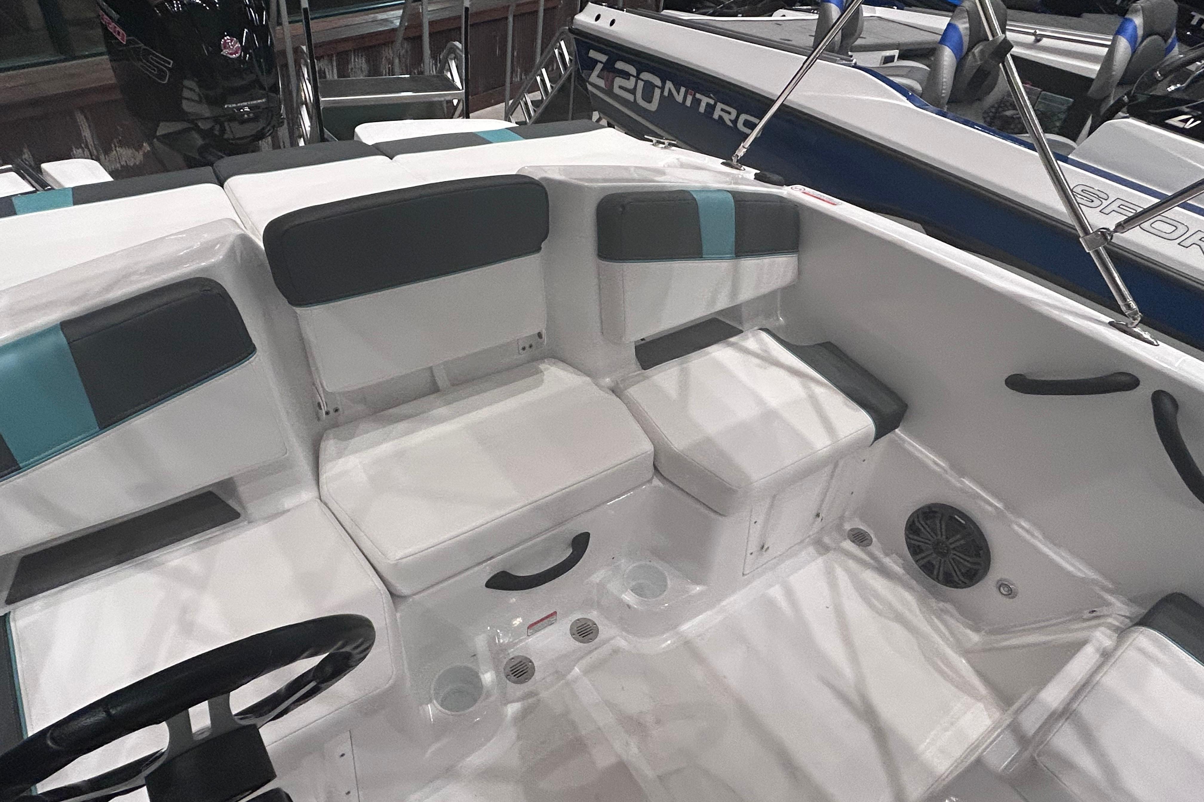 2026 Tahoe T18 boat interior with cushioned seating and steering wheel.
