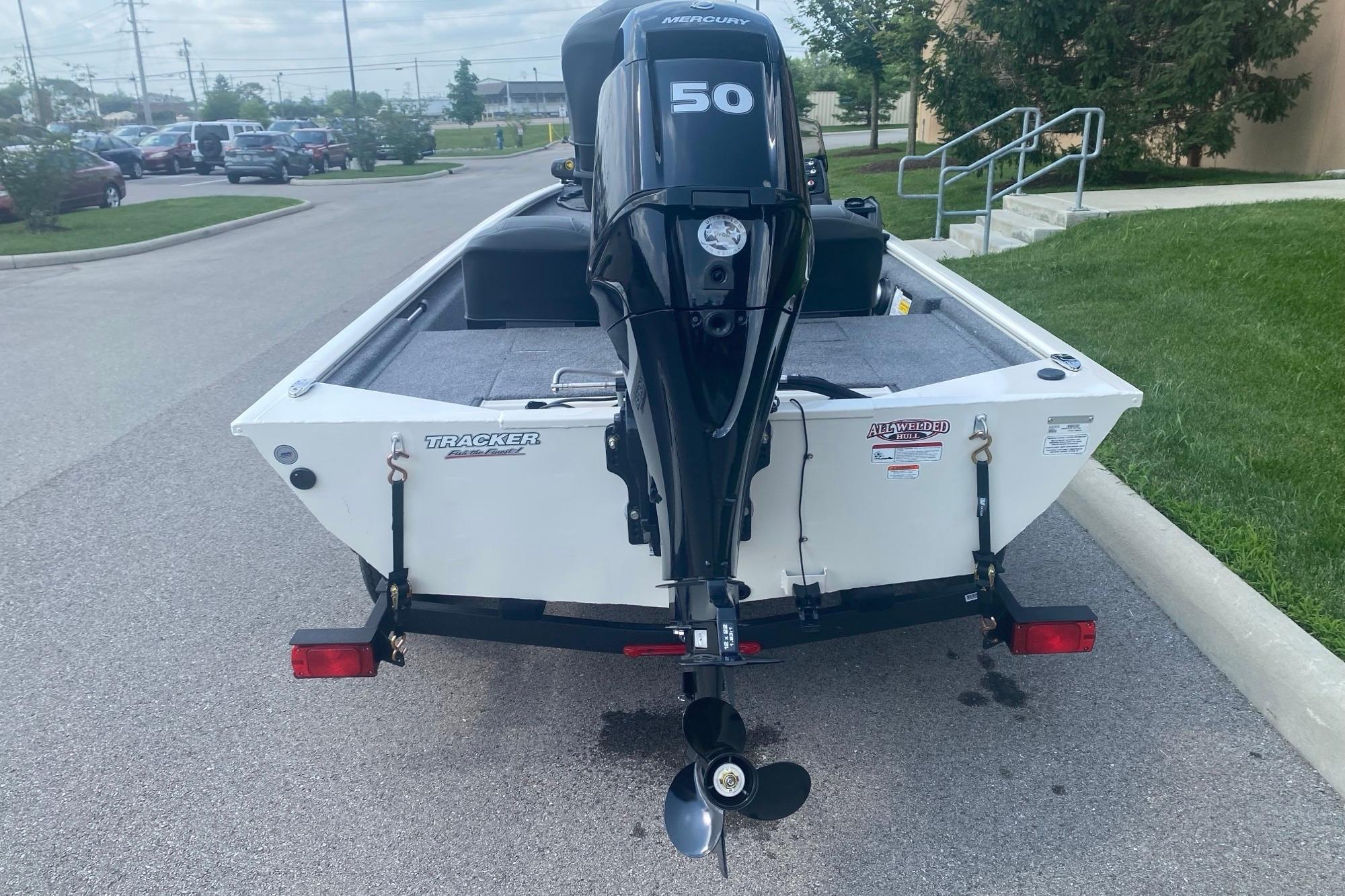 2026 Tracker Pro 170 boat with Mercury 50 engine on trailer, parked outdoors.