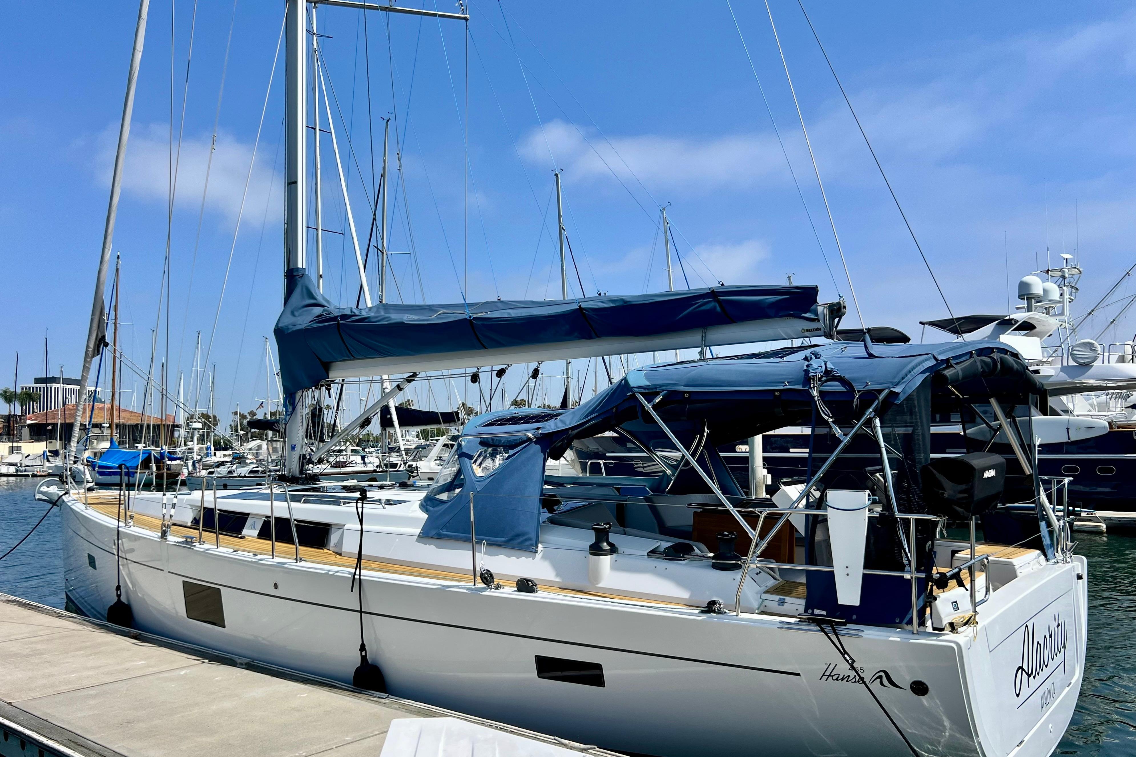 2016 Hanse 455 sailboat docked at marina under clear blue sky.