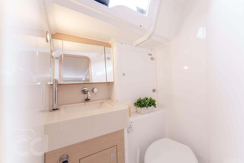 Modern bathroom interior of 2023 Dufour 37 yacht, featuring sleek design and compact amenities.