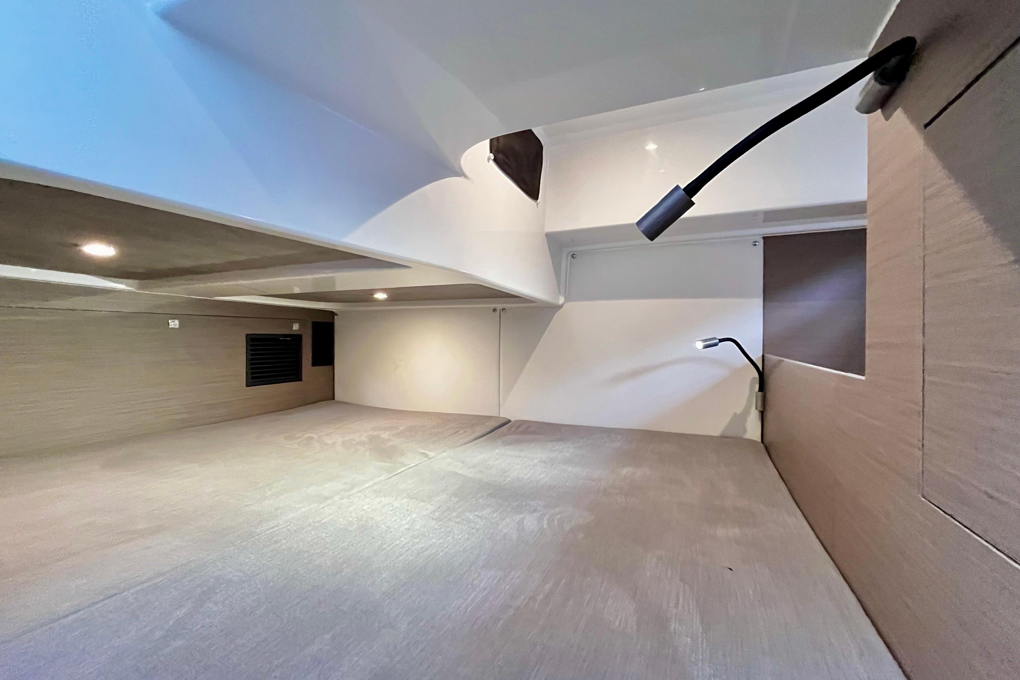 2023 Beneteau Gran Turismo 32 cabin interior with modern lighting and sleek design.