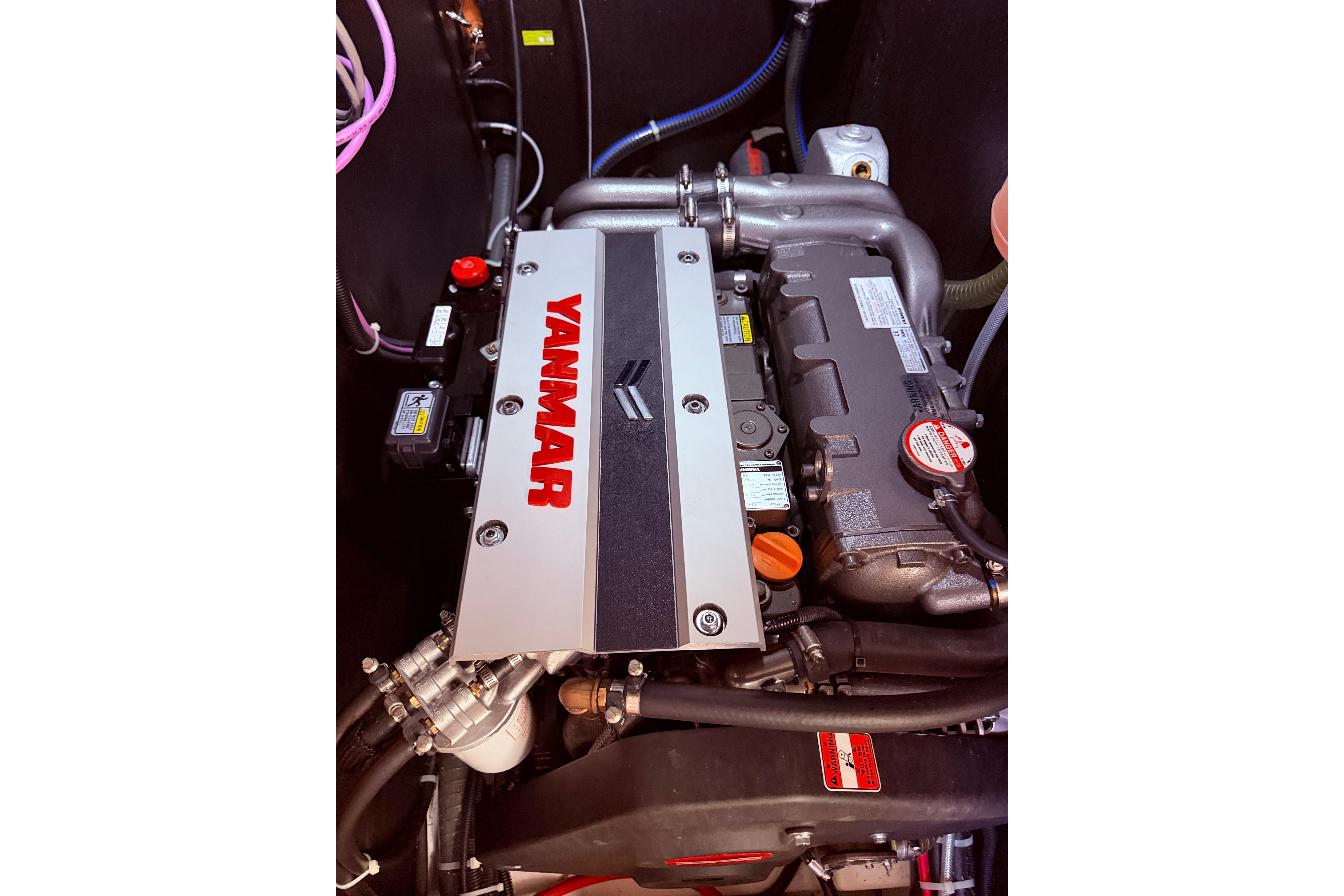 Yanmar engine in 2022 Beneteau Oceanis Yacht 54, showcasing detailed components.